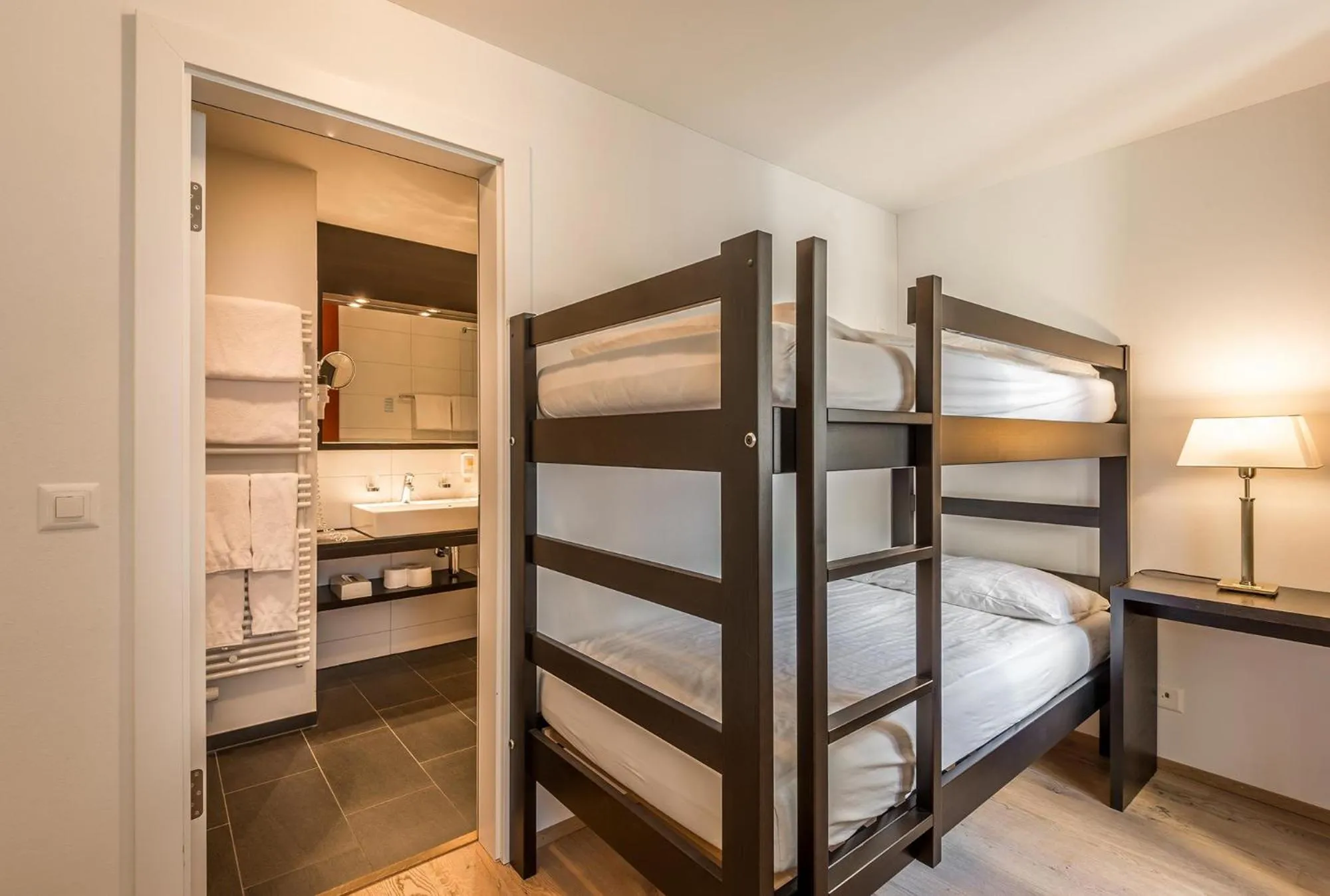 Photo of the whole room, Bed in Hotel Alpina Luzern