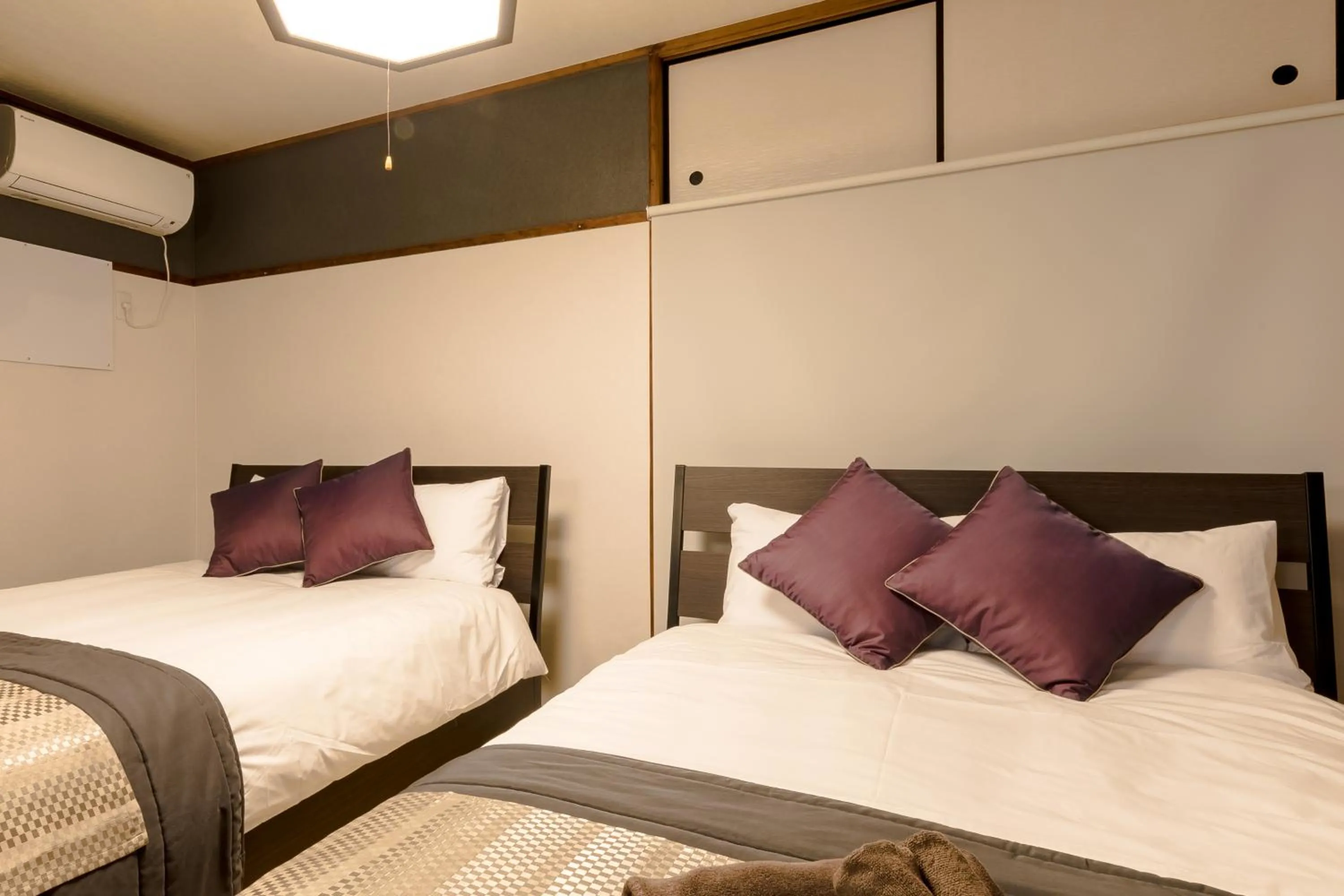 Bed in Fuji Heights Hotel