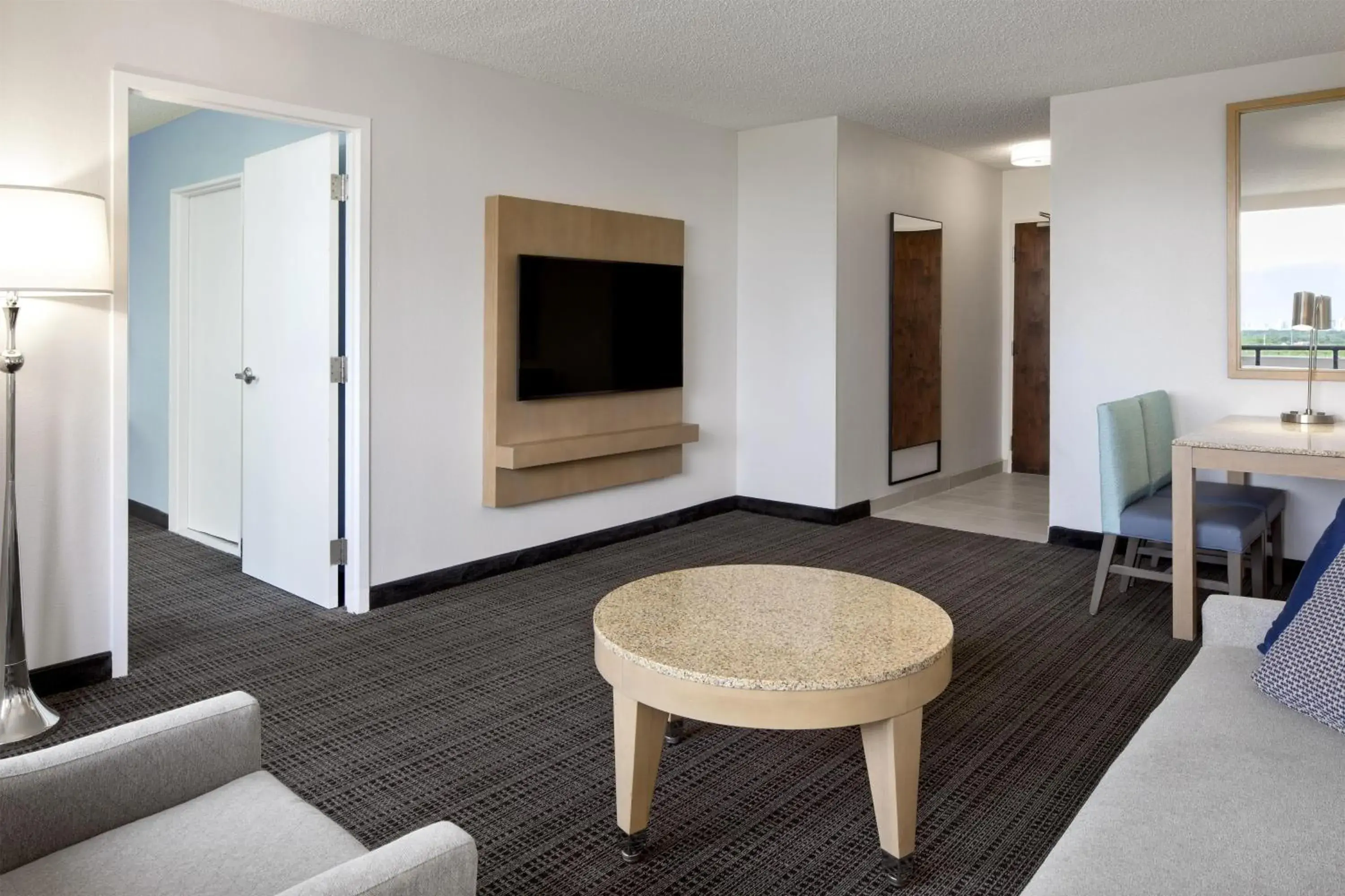 Living room in Embassy Suites by Hilton Tampa Airport Westshore Living room in Embassy Suites by Hilton Tampa Airport Westshore