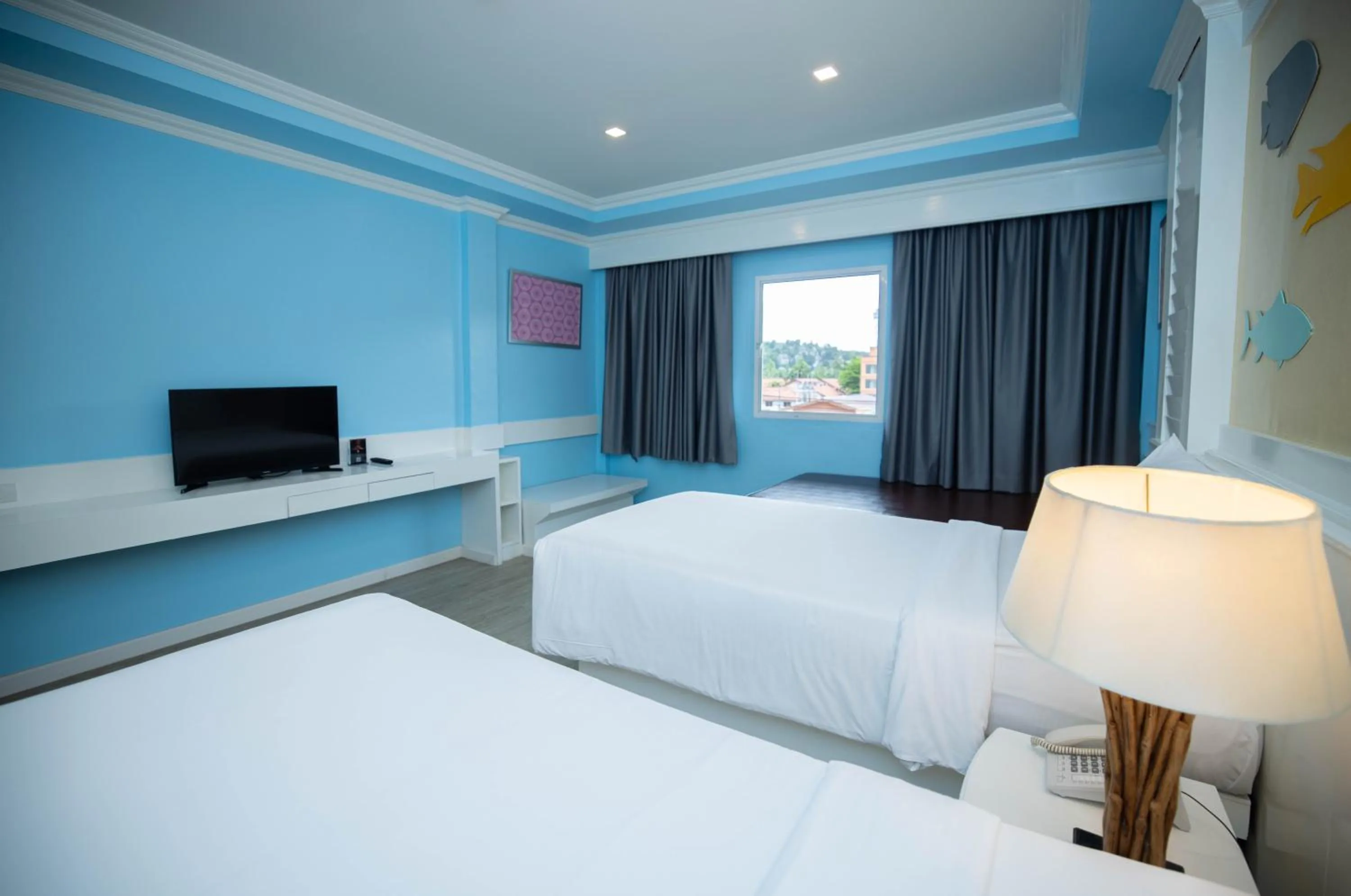 Bed in Baumanburi Hotel Patong