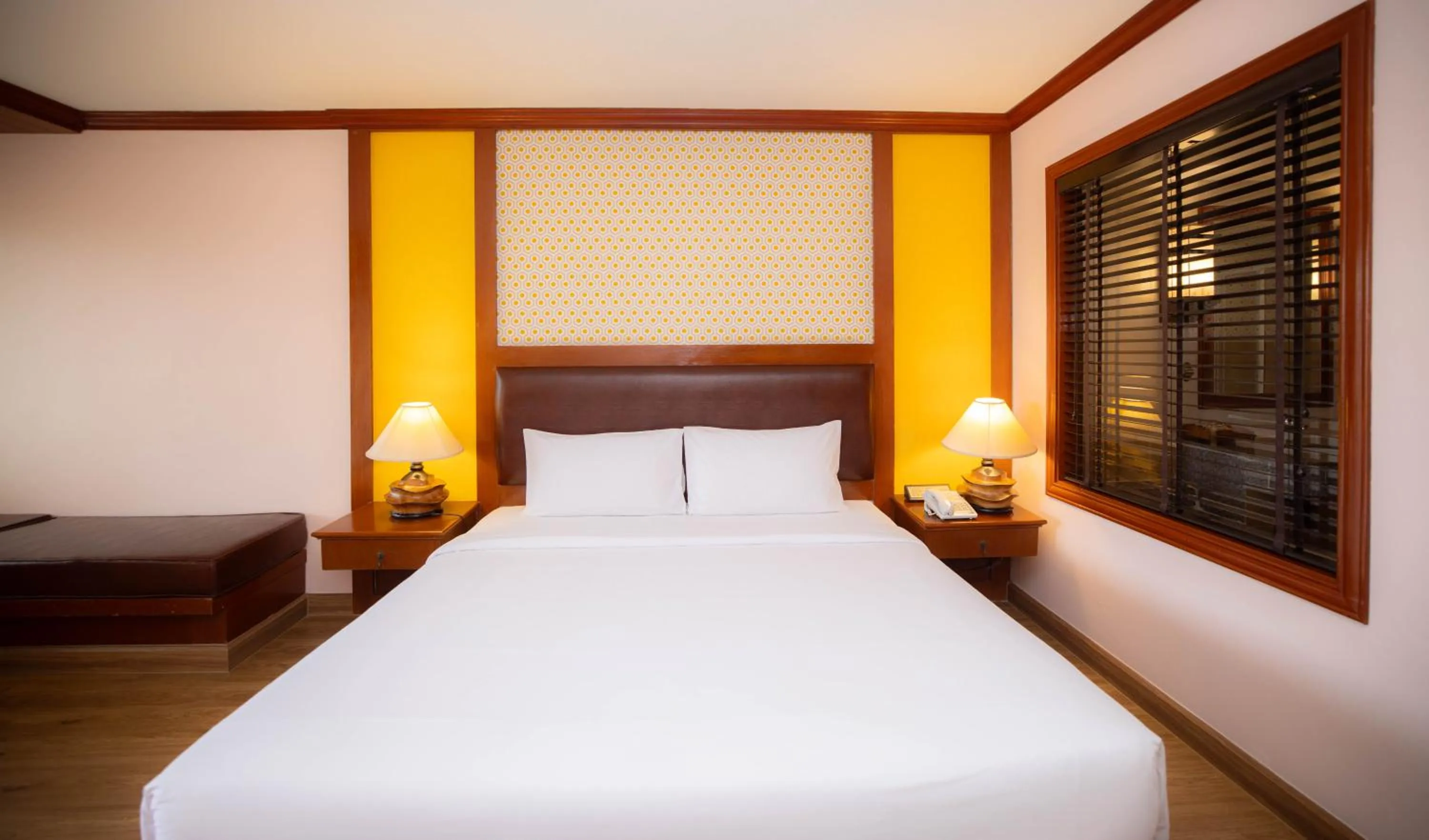 Bed in Baumanburi Hotel Patong