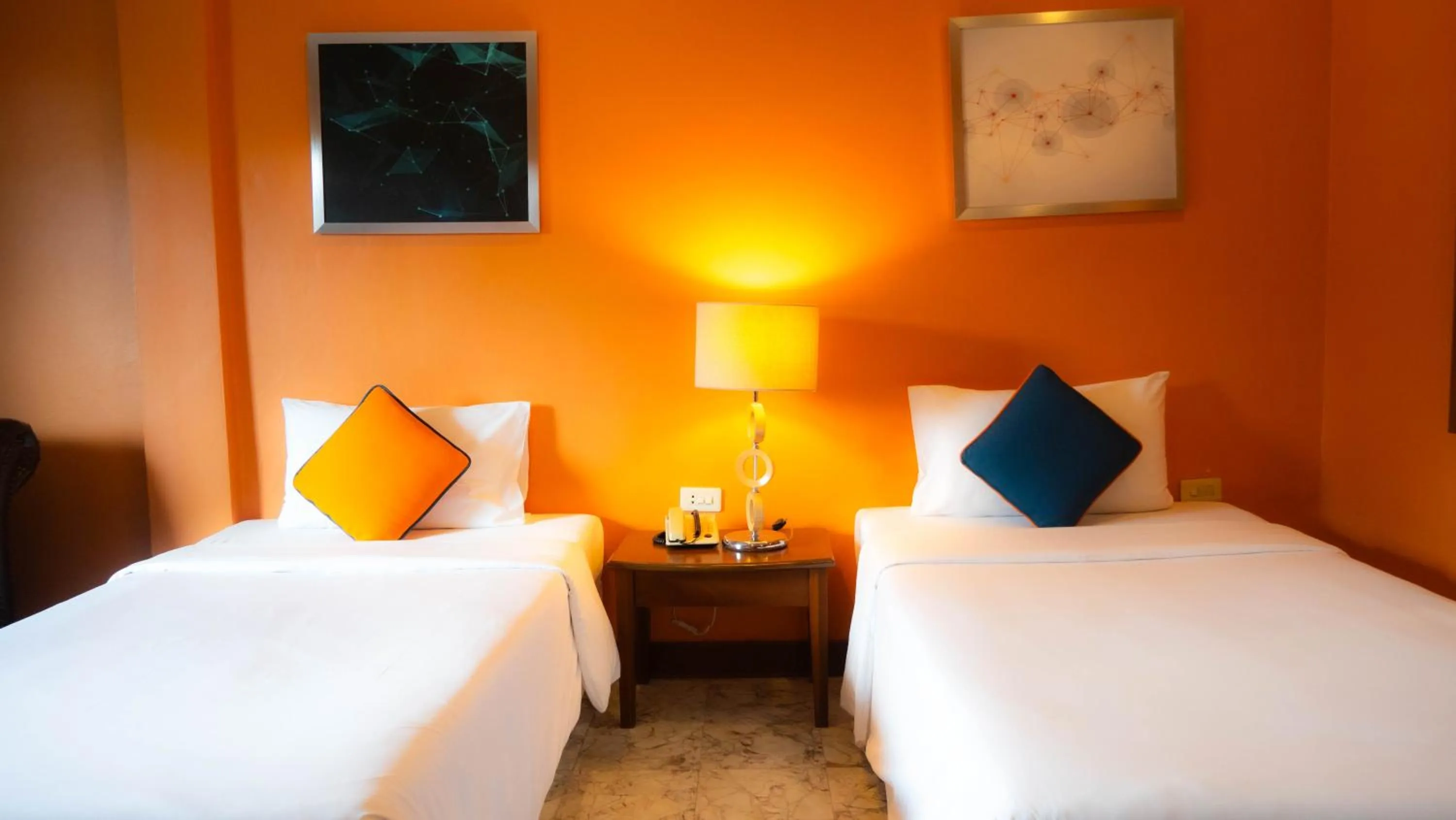 Bed in Baumanburi Hotel Patong