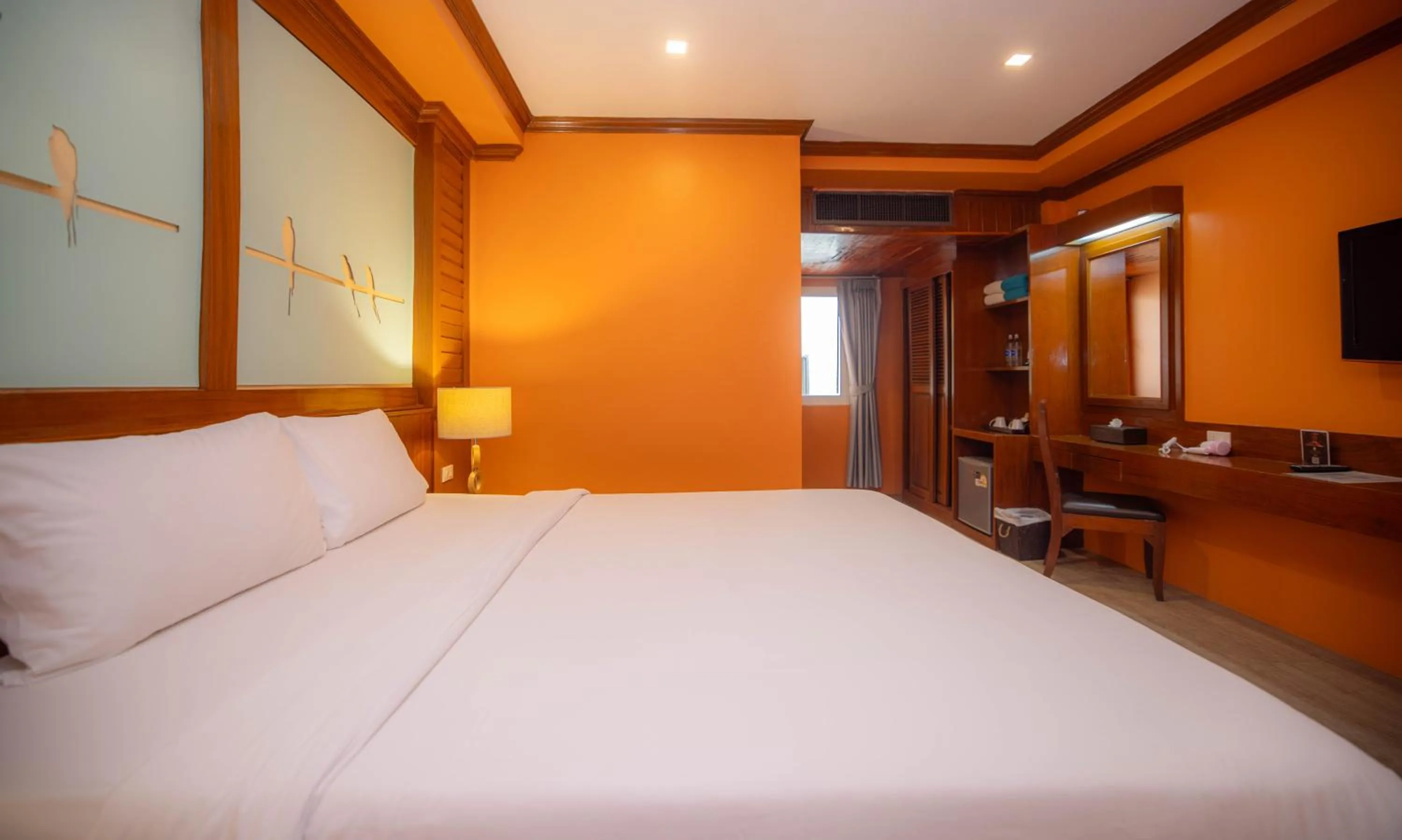 Bed in Baumanburi Hotel Patong