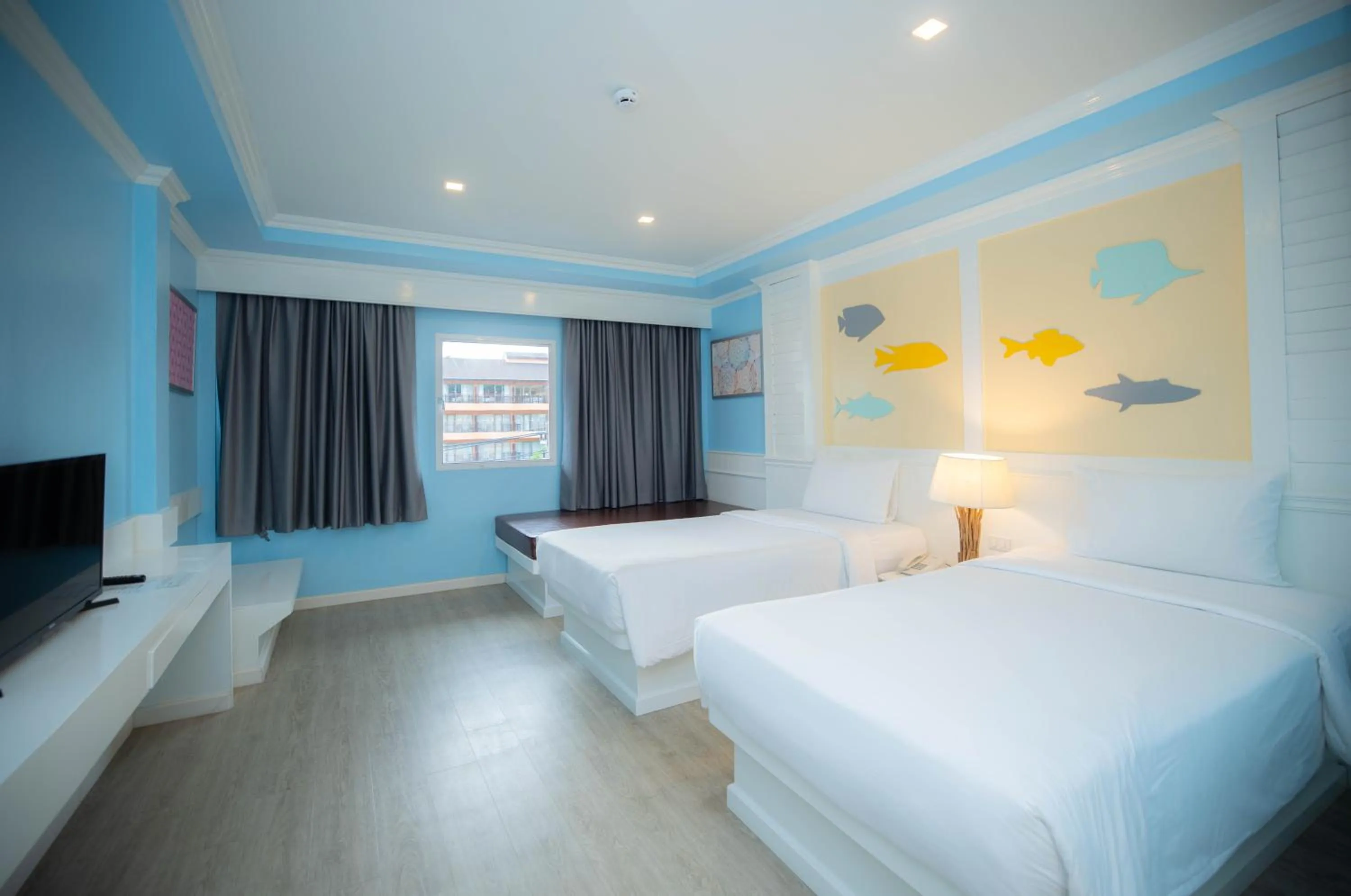 Bed in Baumanburi Hotel Patong