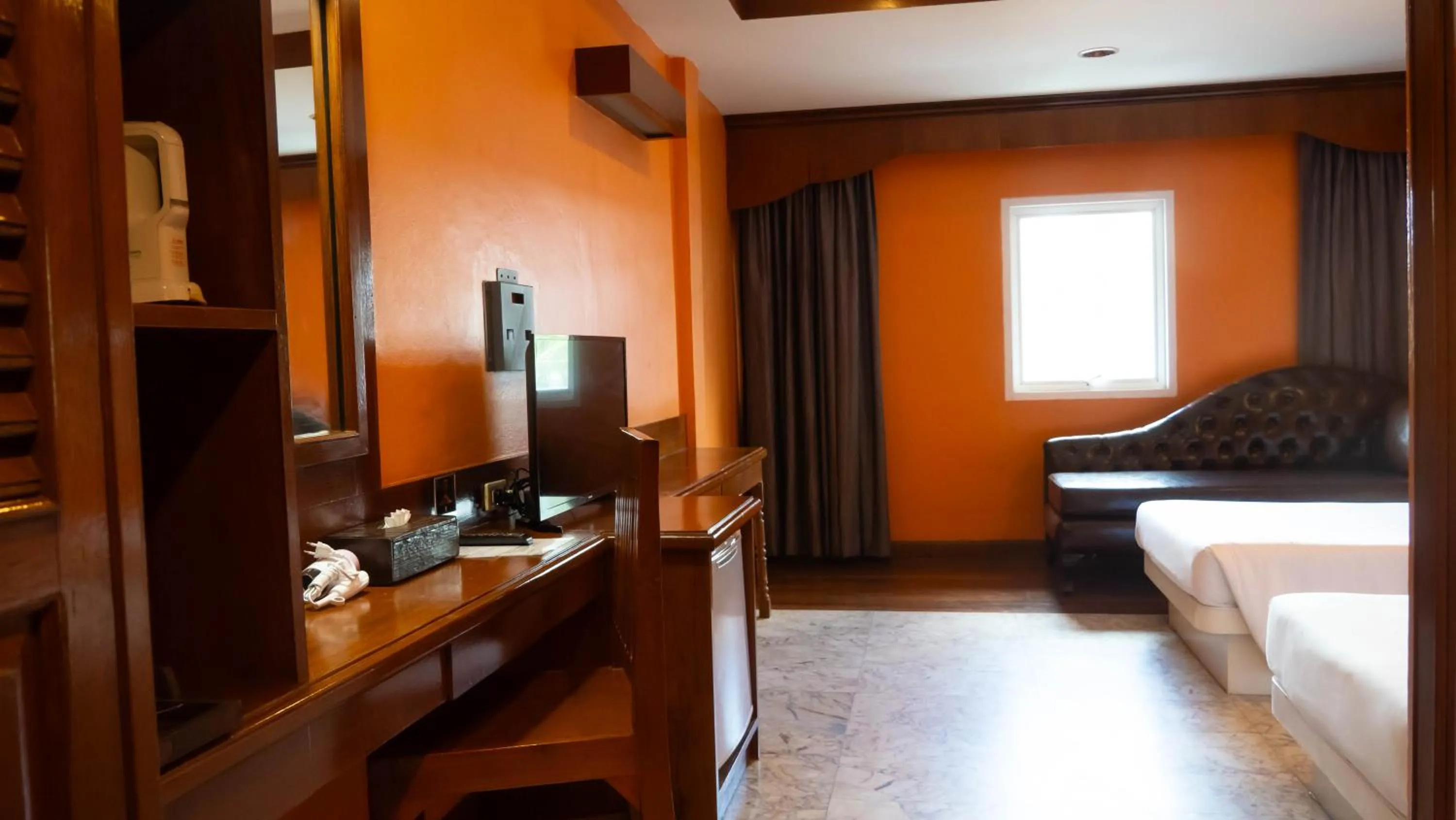 Bed in Baumanburi Hotel Patong