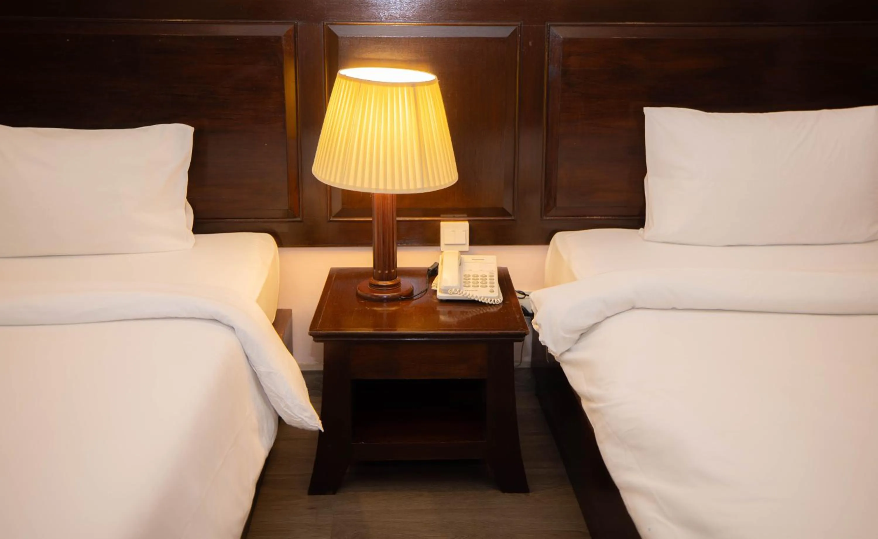 Bed in Baumanburi Hotel Patong