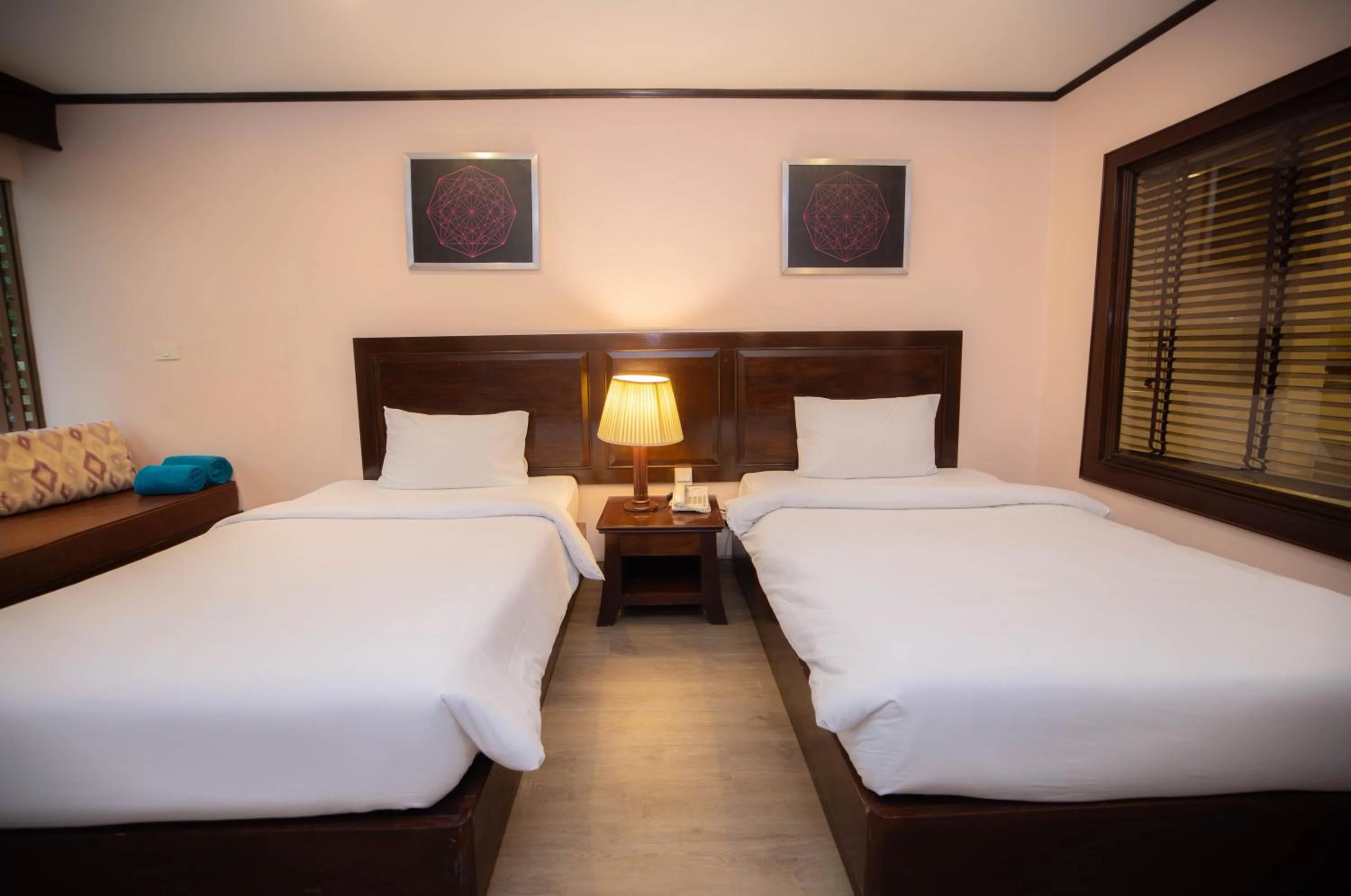 Bed in Baumanburi Hotel Patong