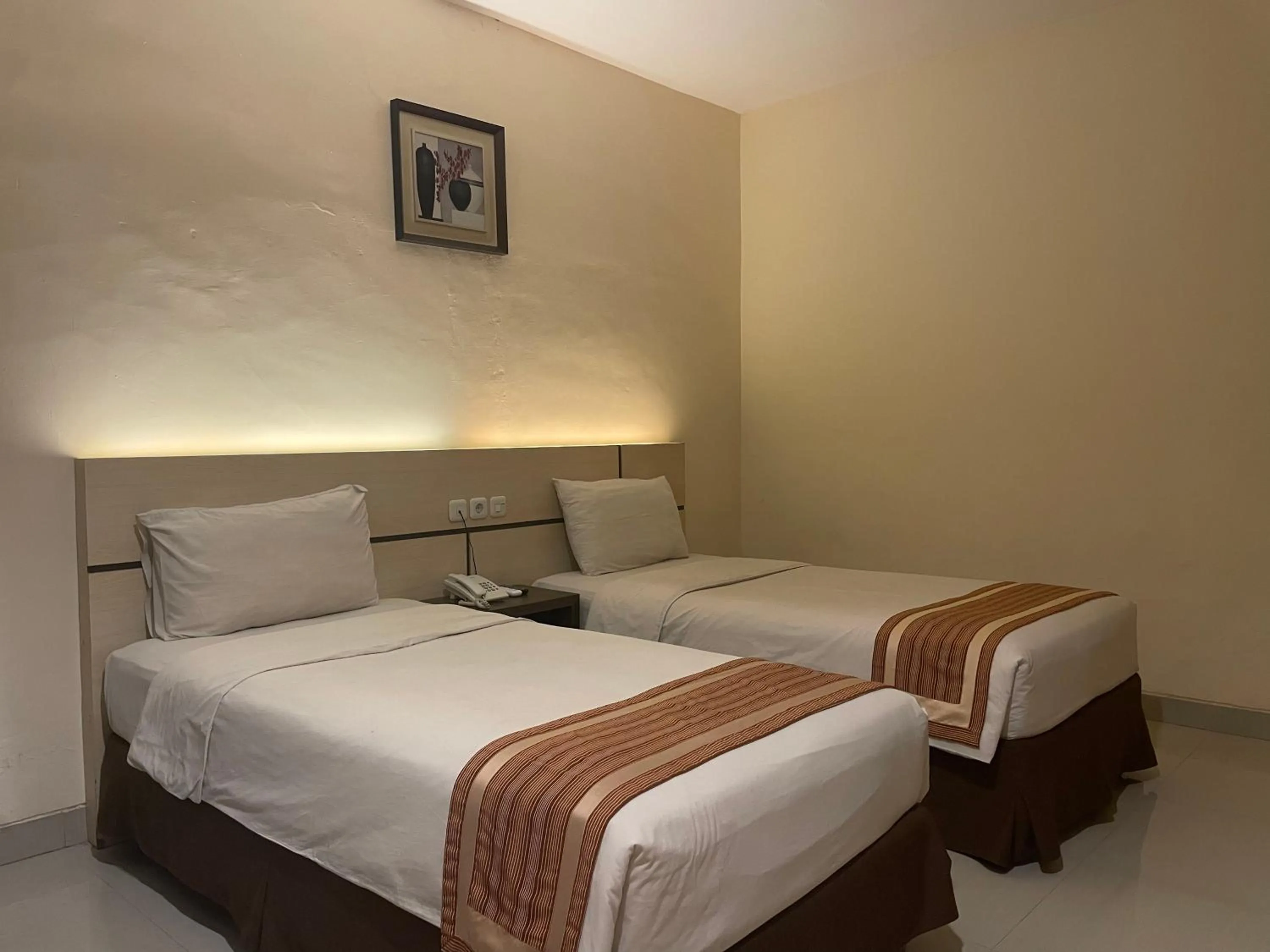 Bed in Jolin Hotel Makassar