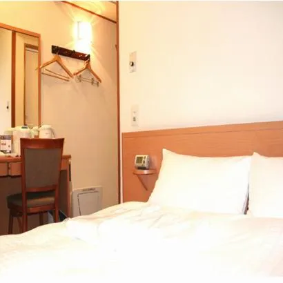 Bed in Smile Hotel Hachinohe