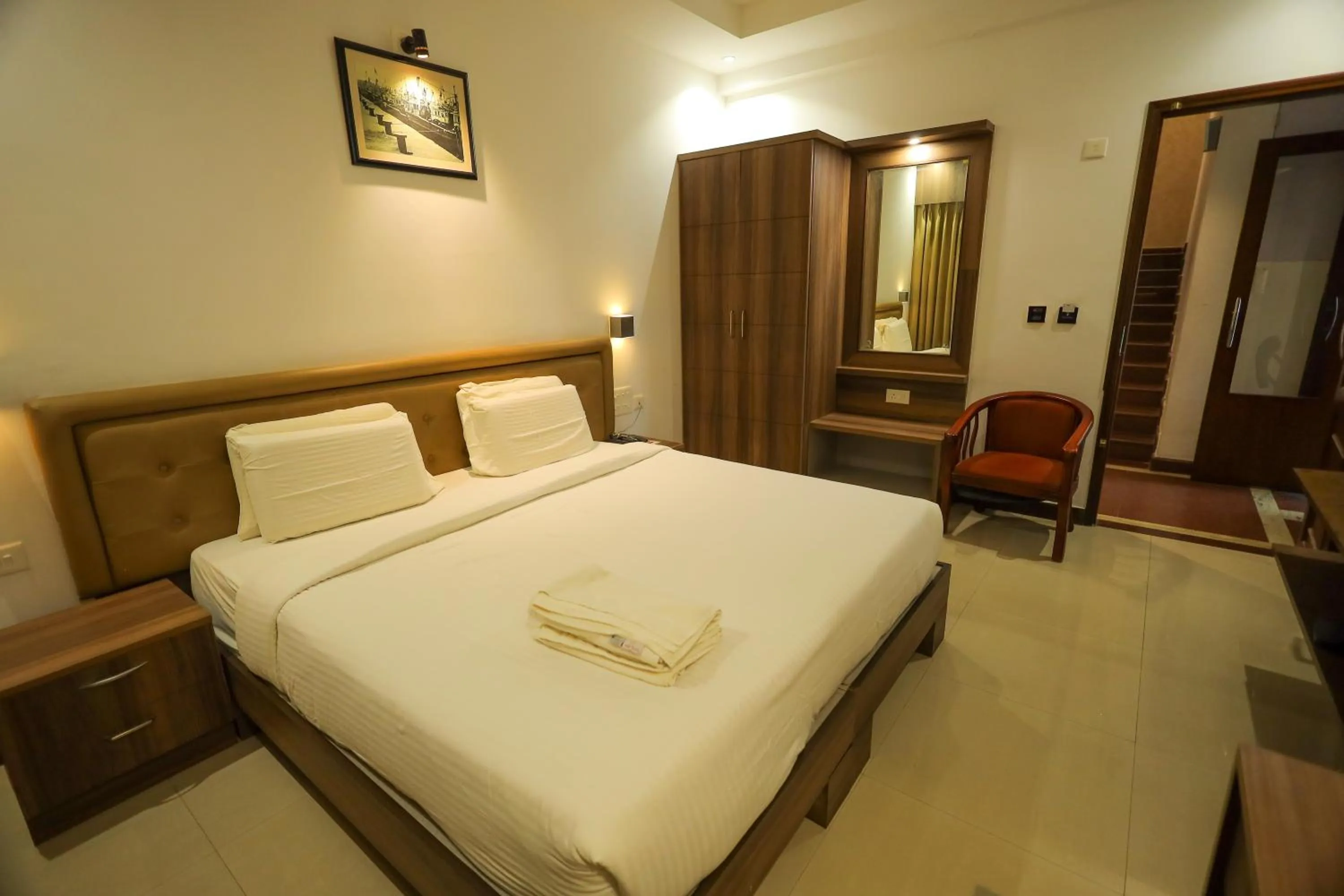 Bedroom, Bed in Metro Plaza Hotel by RAK Rooms, Mangaluru