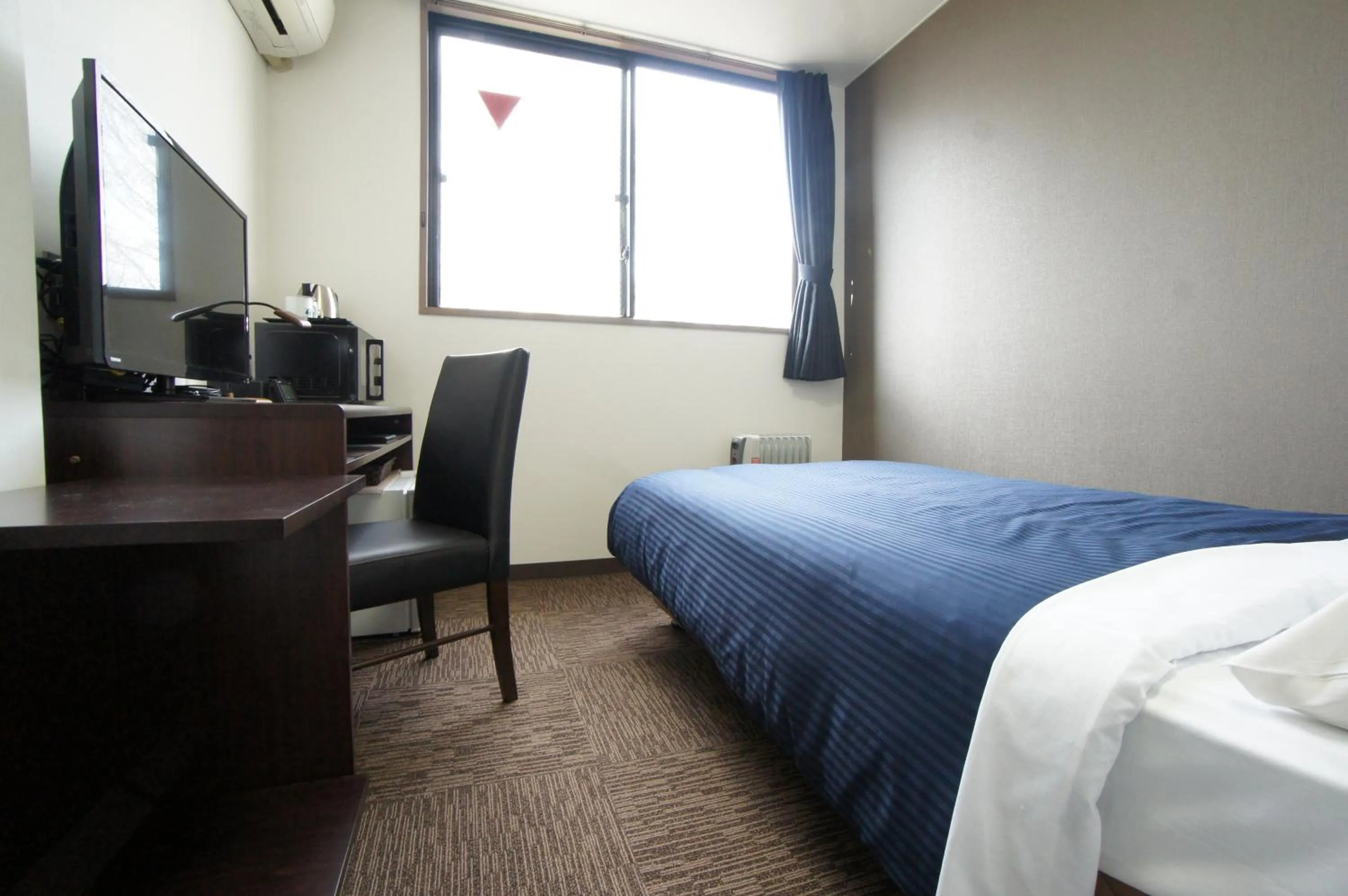 Bed in HOTEL LiVEMAX BUDGET Gunma Numata