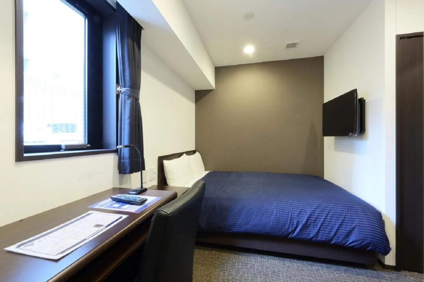 Bed in HOTEL LiVEMAX Meieki