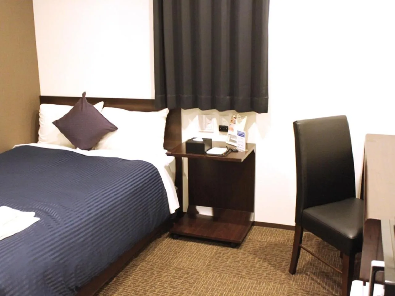 Bed in HOTEL LiVEMAX Meieki