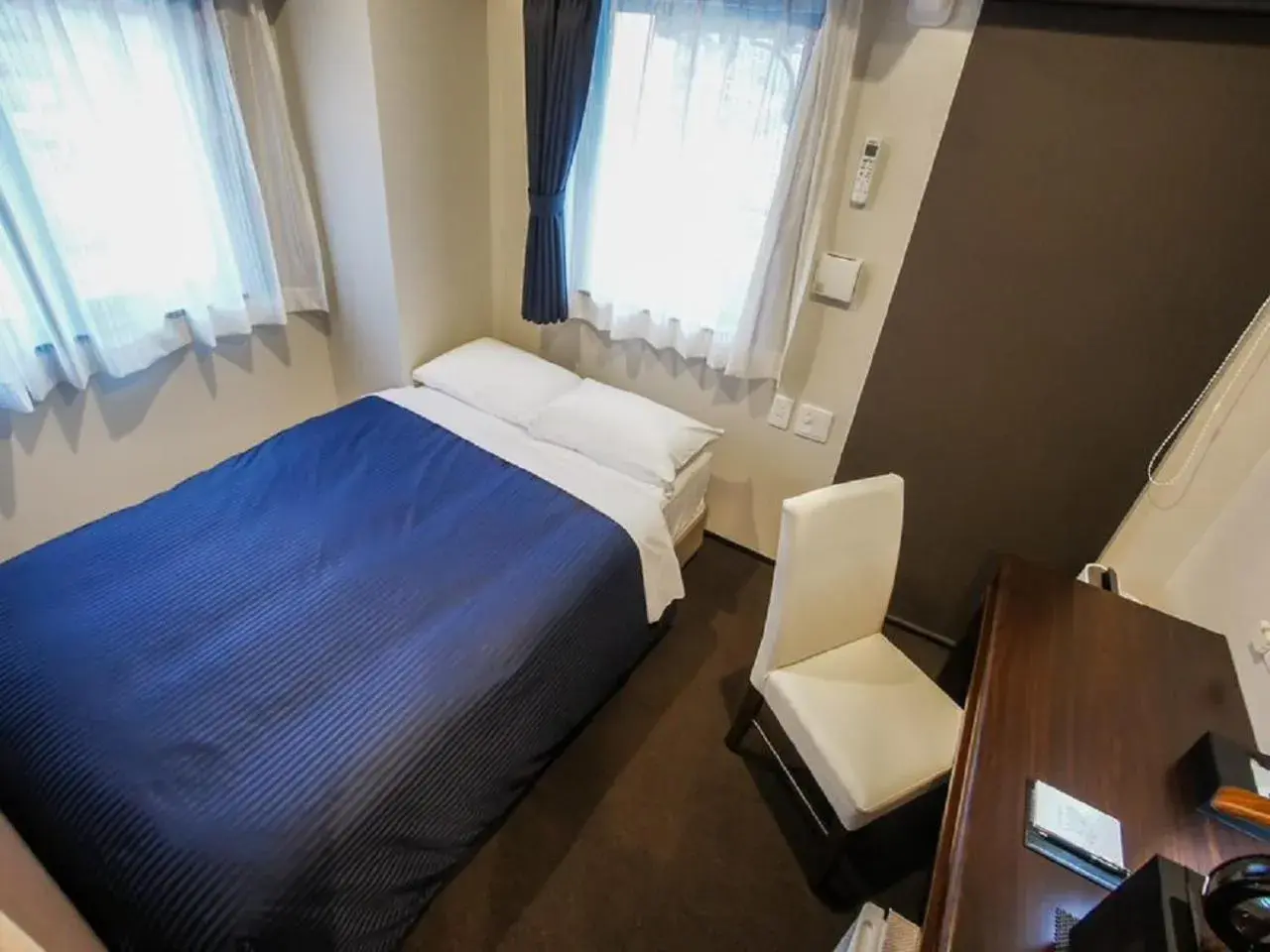 Bed in HOTEL LiVEMAX Umeda Doyama Bed in HOTEL LiVEMAX Umeda Doyama