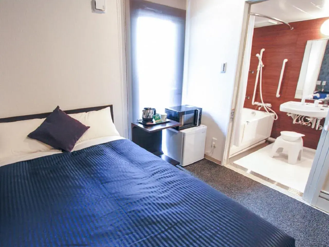 Bed in HOTEL LiVEMAX Kobe Sannomiya Bed in HOTEL LiVEMAX Kobe Sannomiya