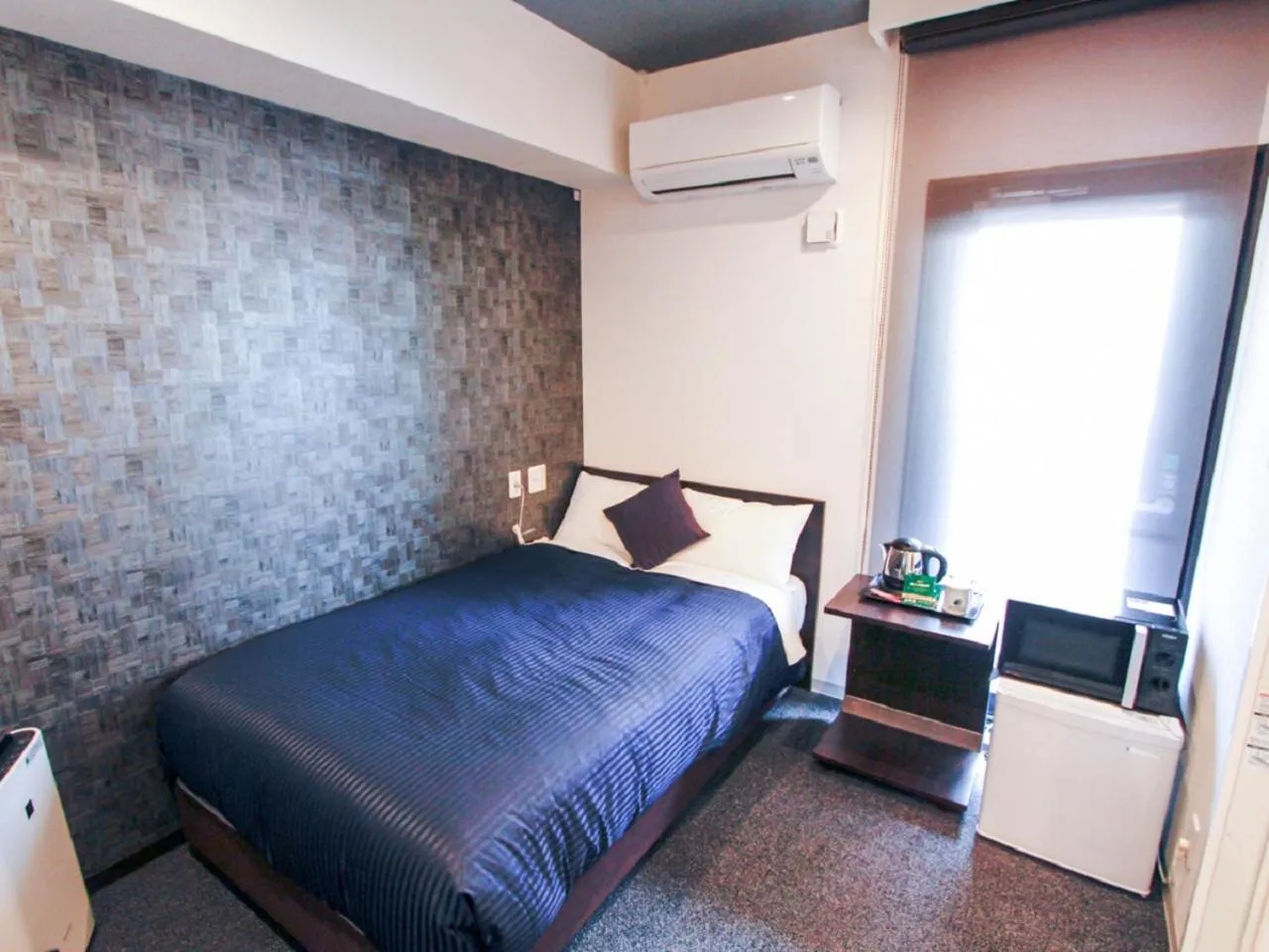 Bed in HOTEL LiVEMAX Kobe Sannomiya