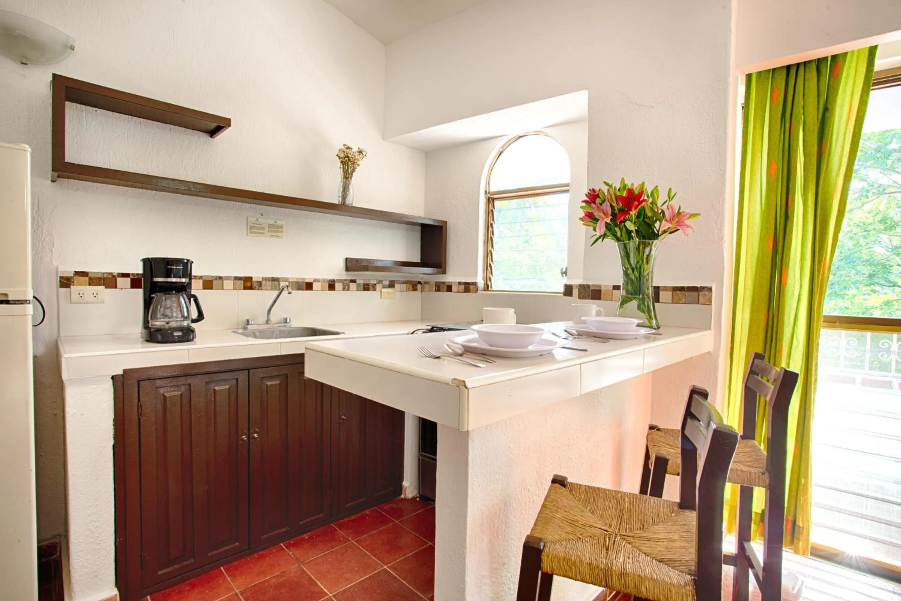 Kitchen or kitchenette in Suites Plaza del Rio - Family Hotel Malecón Centro