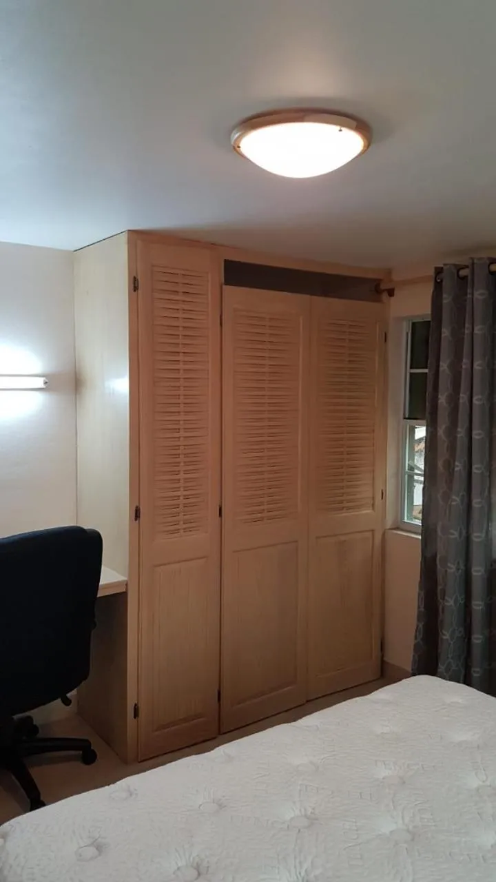 wardrobe, Bed in Cool Running Apartments