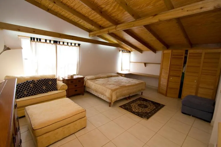 Seating area, Bed in Cool Running Apartments
