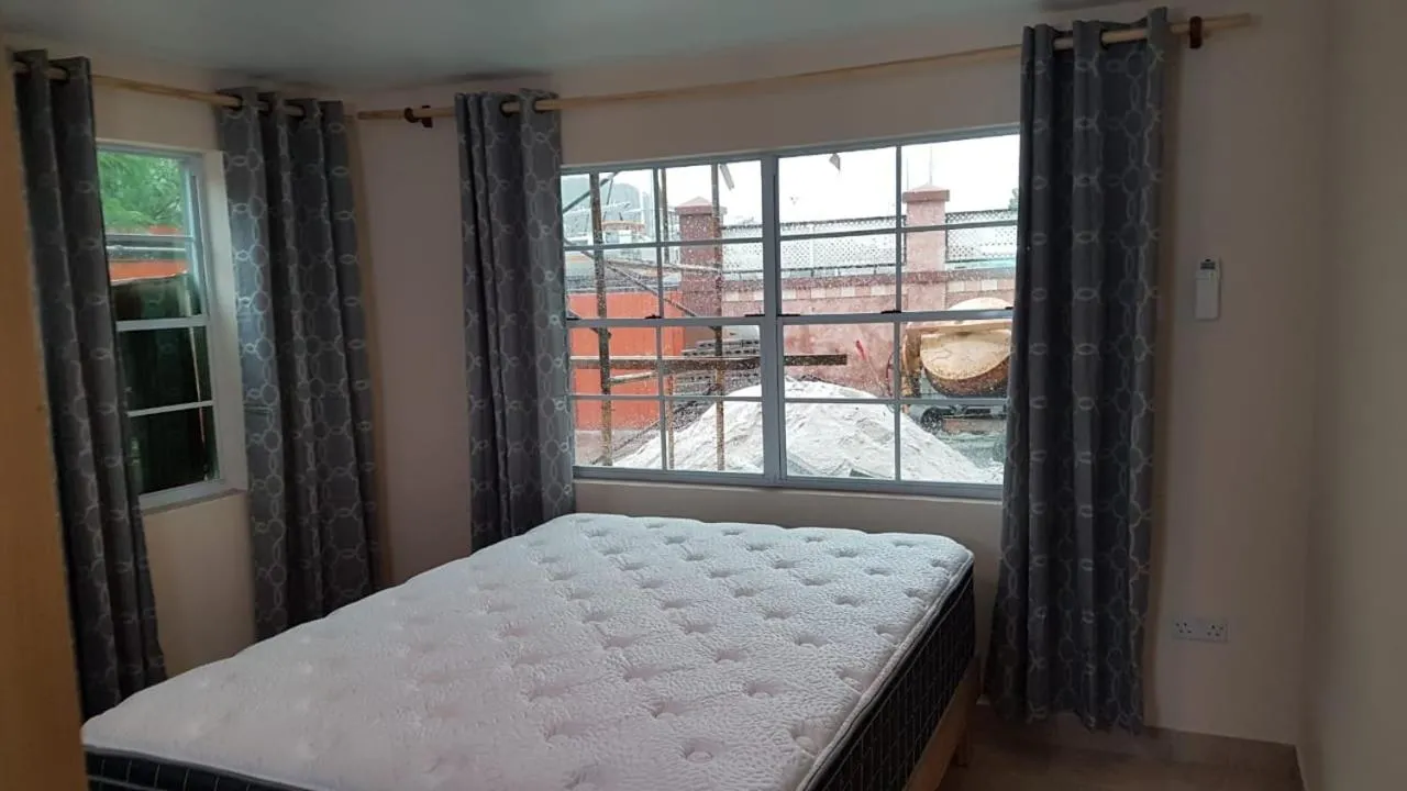 Bed in Cool Running Apartments