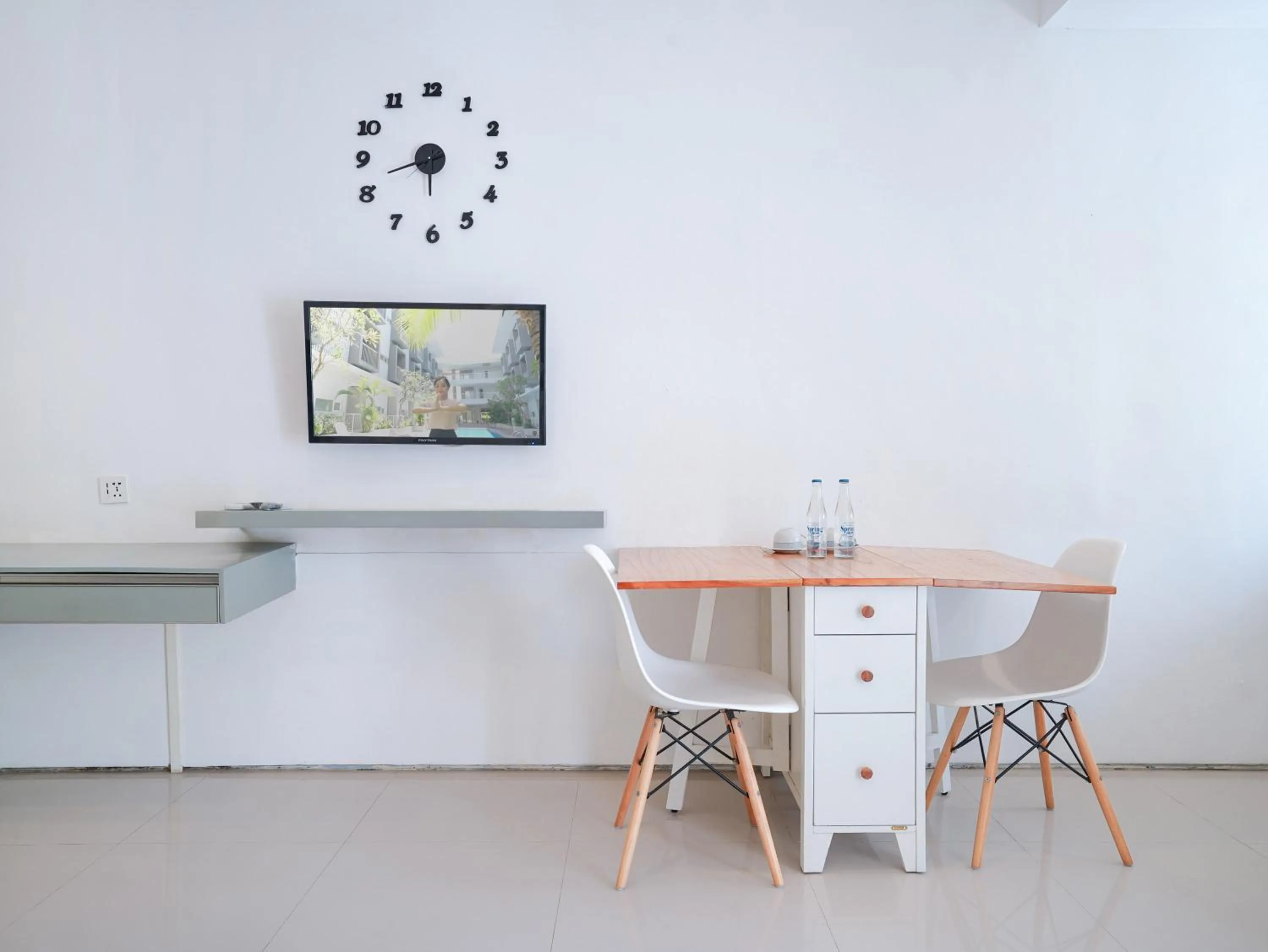 TV and multimedia in The Rooms Apartment Bali by ARM Hospitality