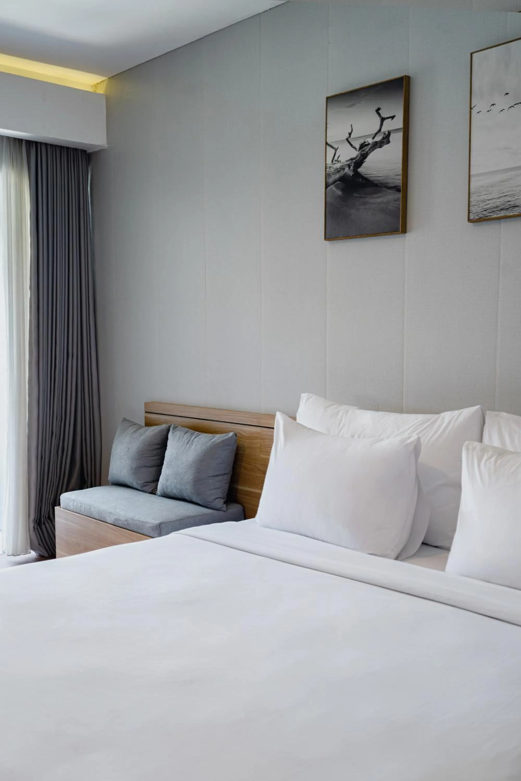 Bed in The Rooms Apartment Bali by ARM Hospitality