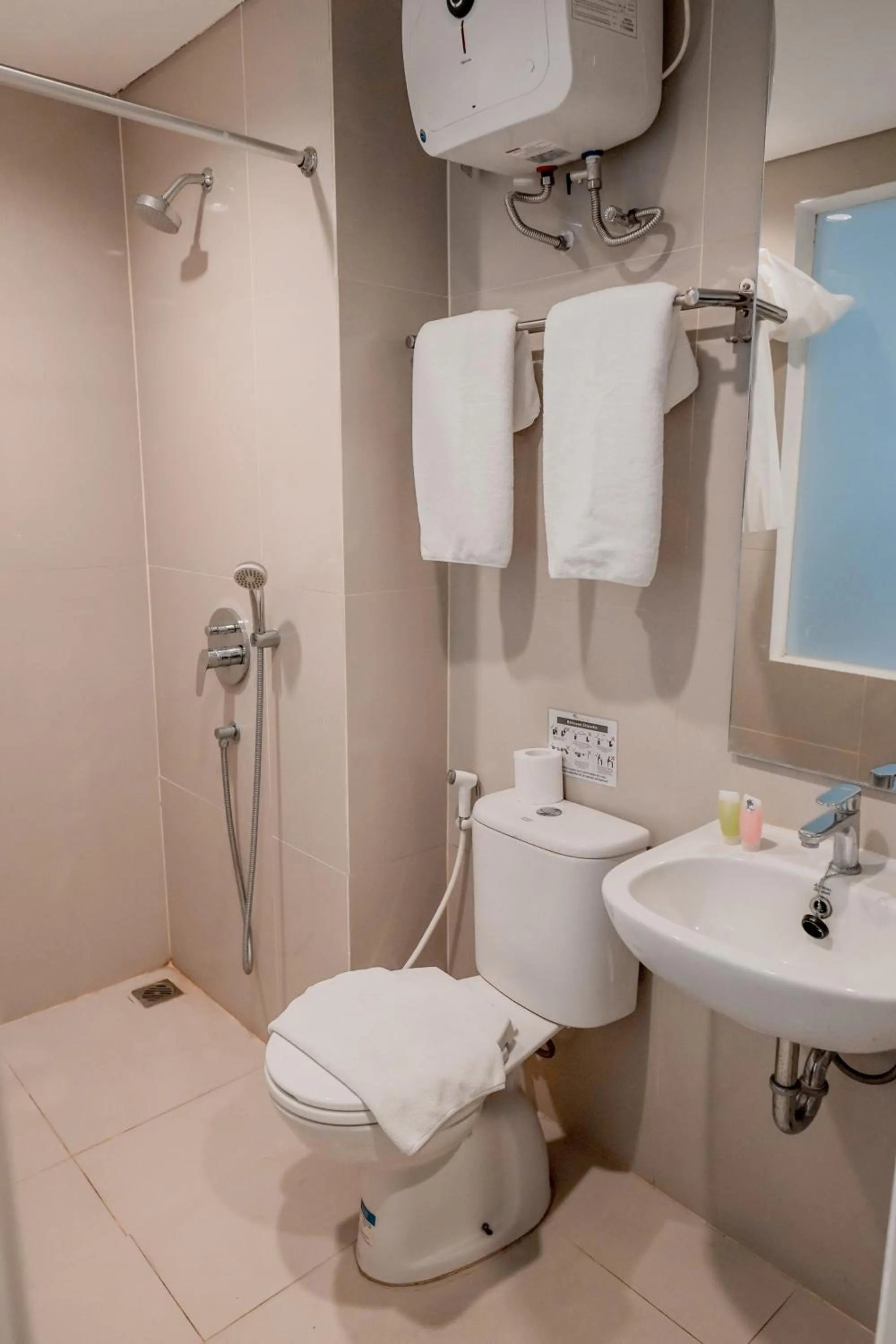 Bathroom in The Rooms Apartment Bali by ARM Hospitality