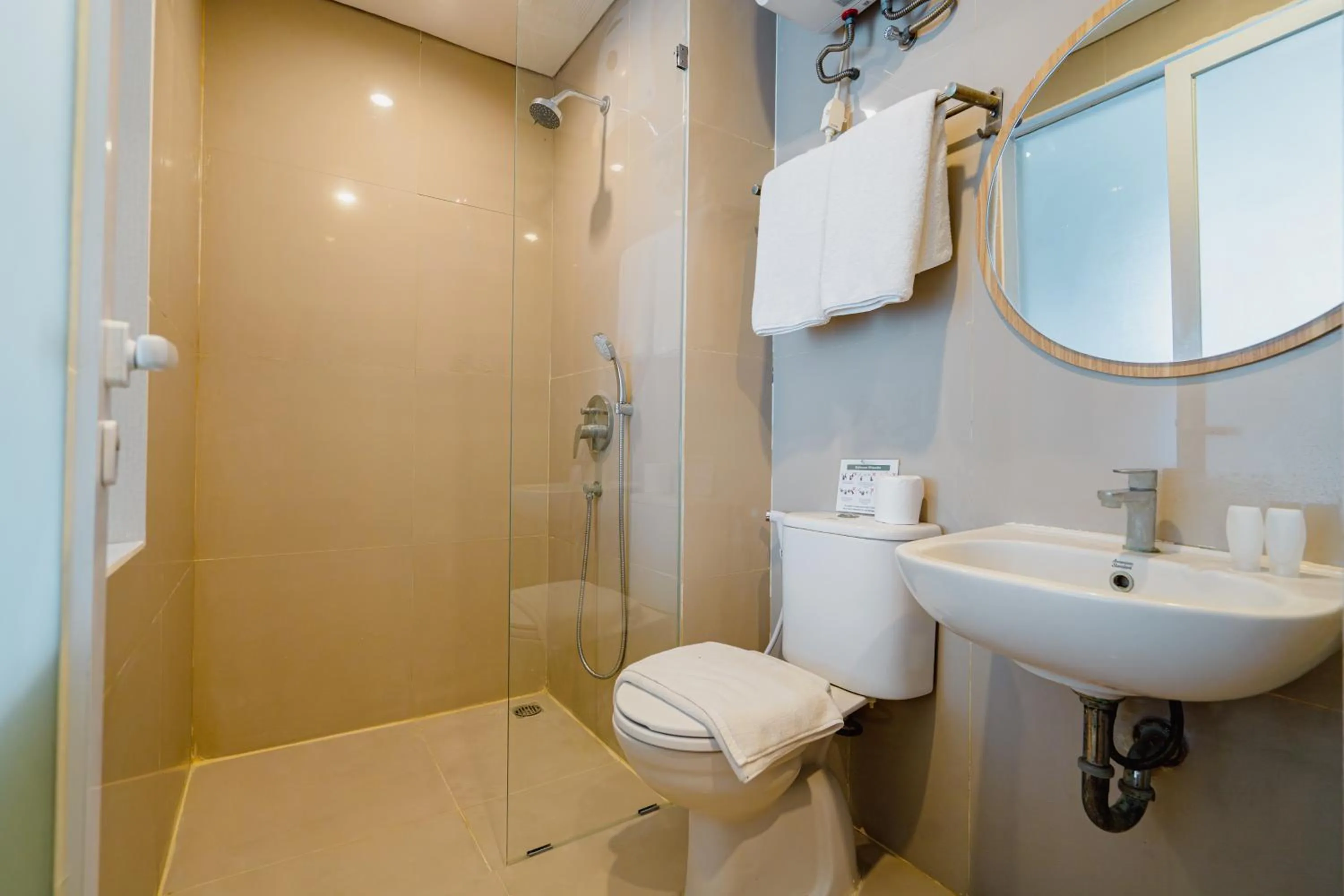 Bathroom in The Rooms Apartment Bali by ARM Hospitality