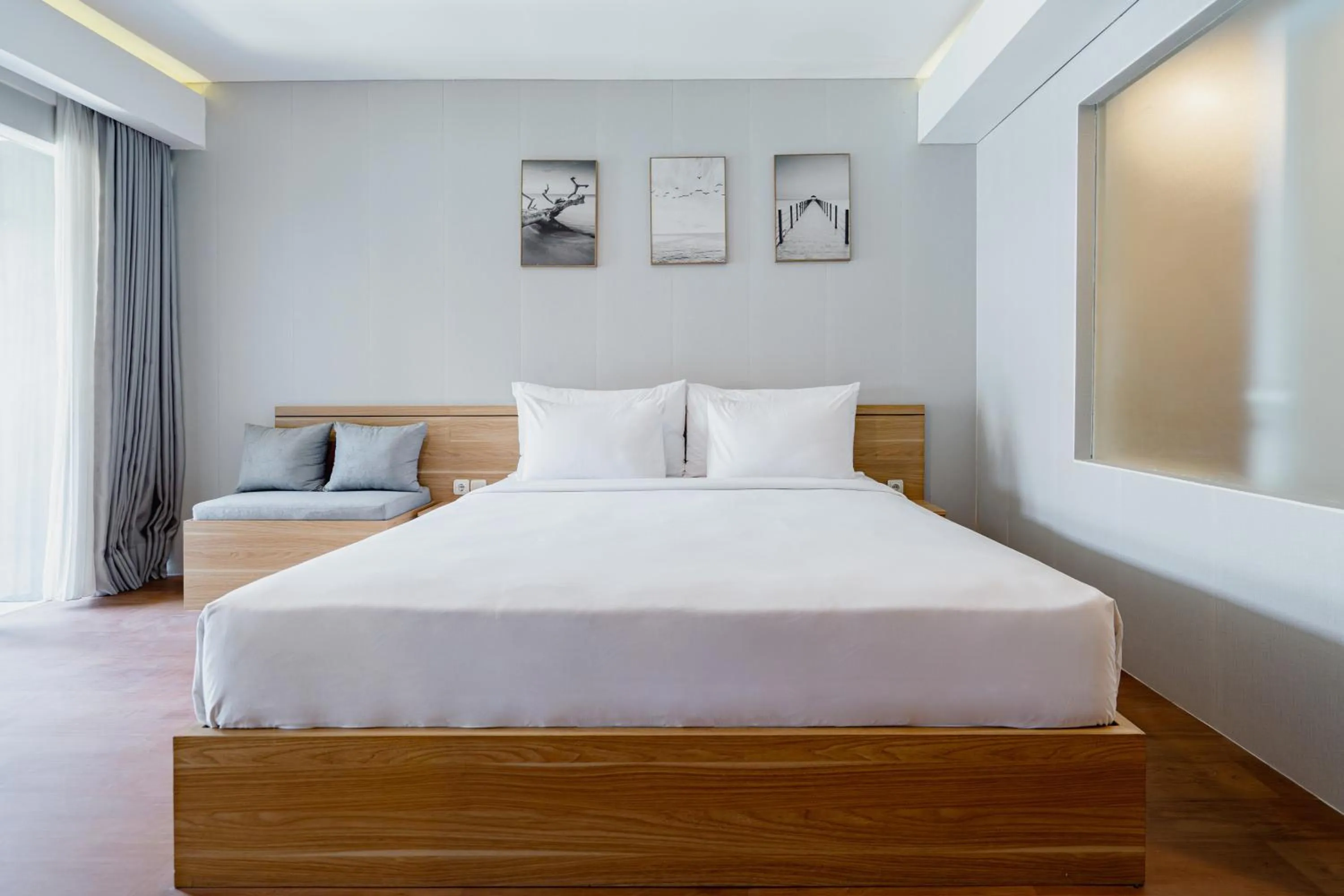 Bed in The Rooms Apartment Bali by ARM Hospitality