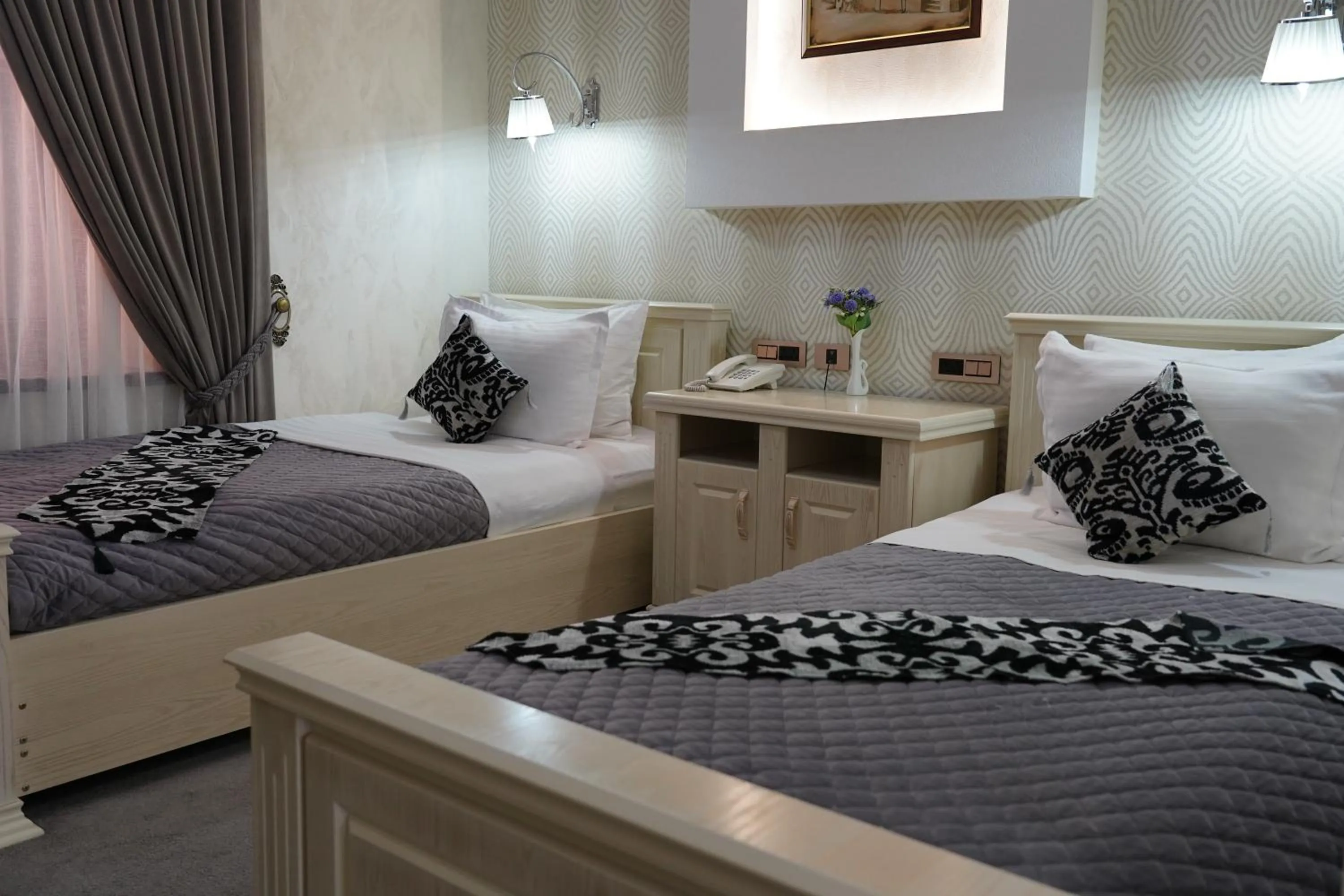 Bed in Shaxzoda Elite Hotel