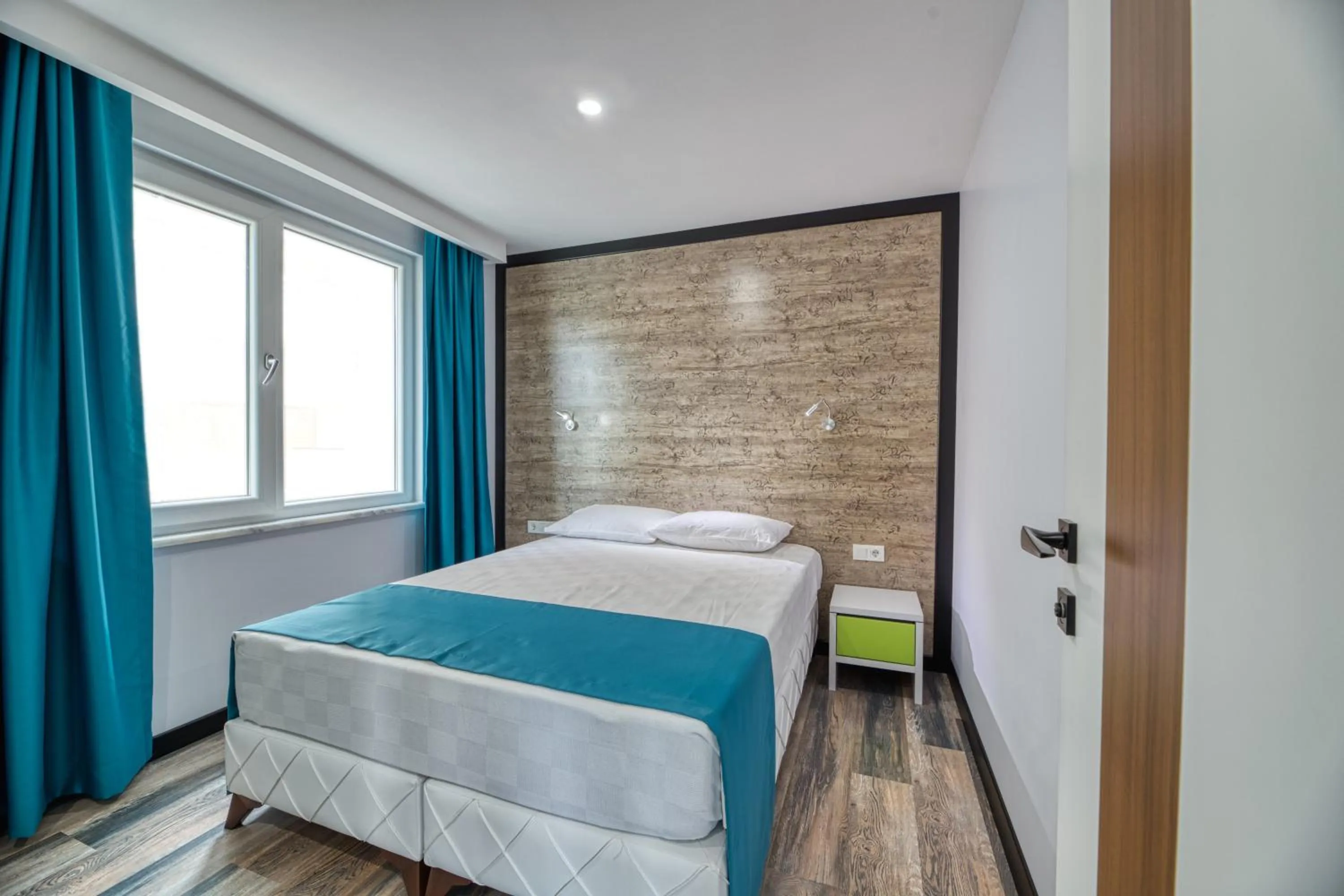 Bed in Grisverde Suites