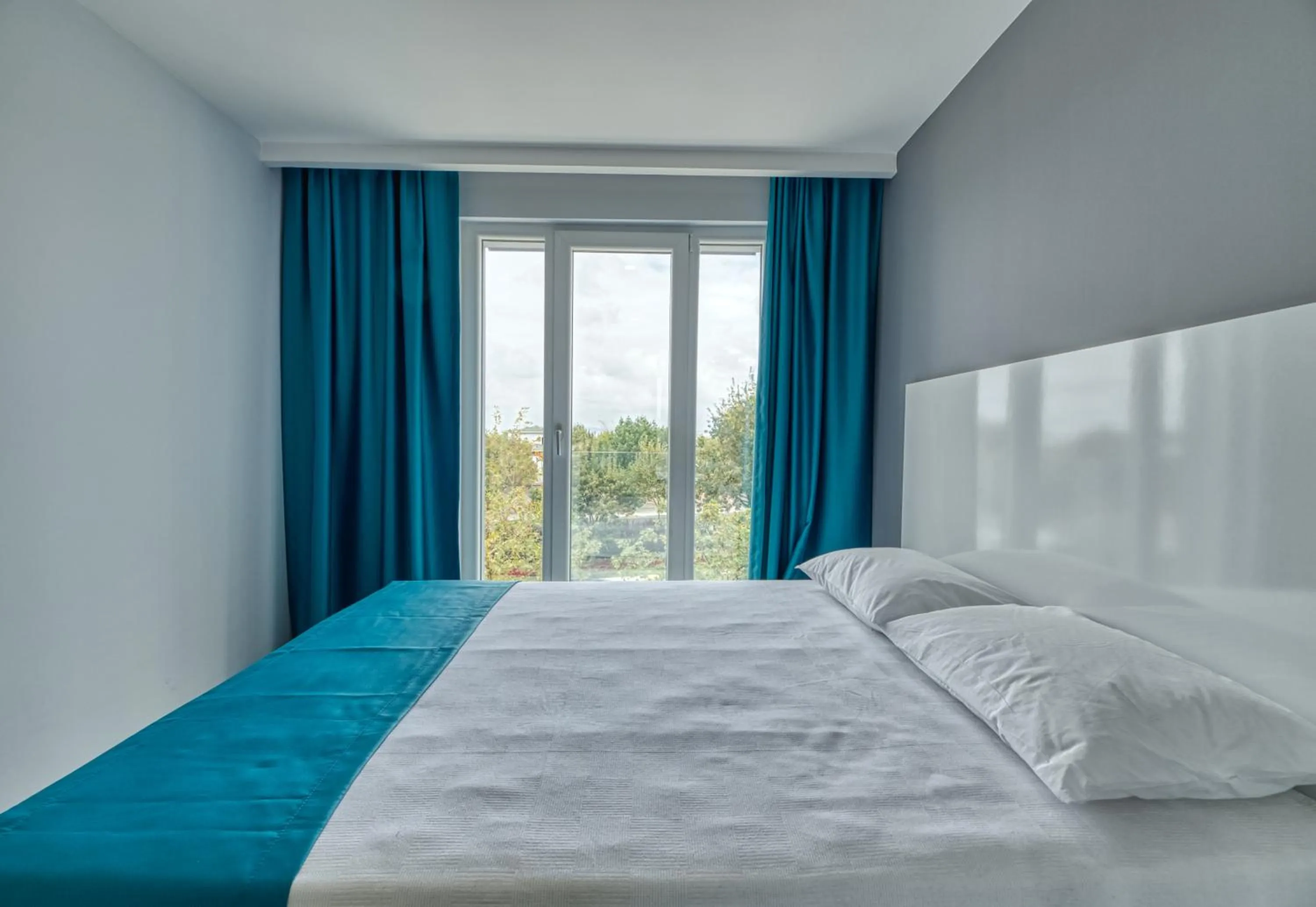 Bed in Grisverde Suites