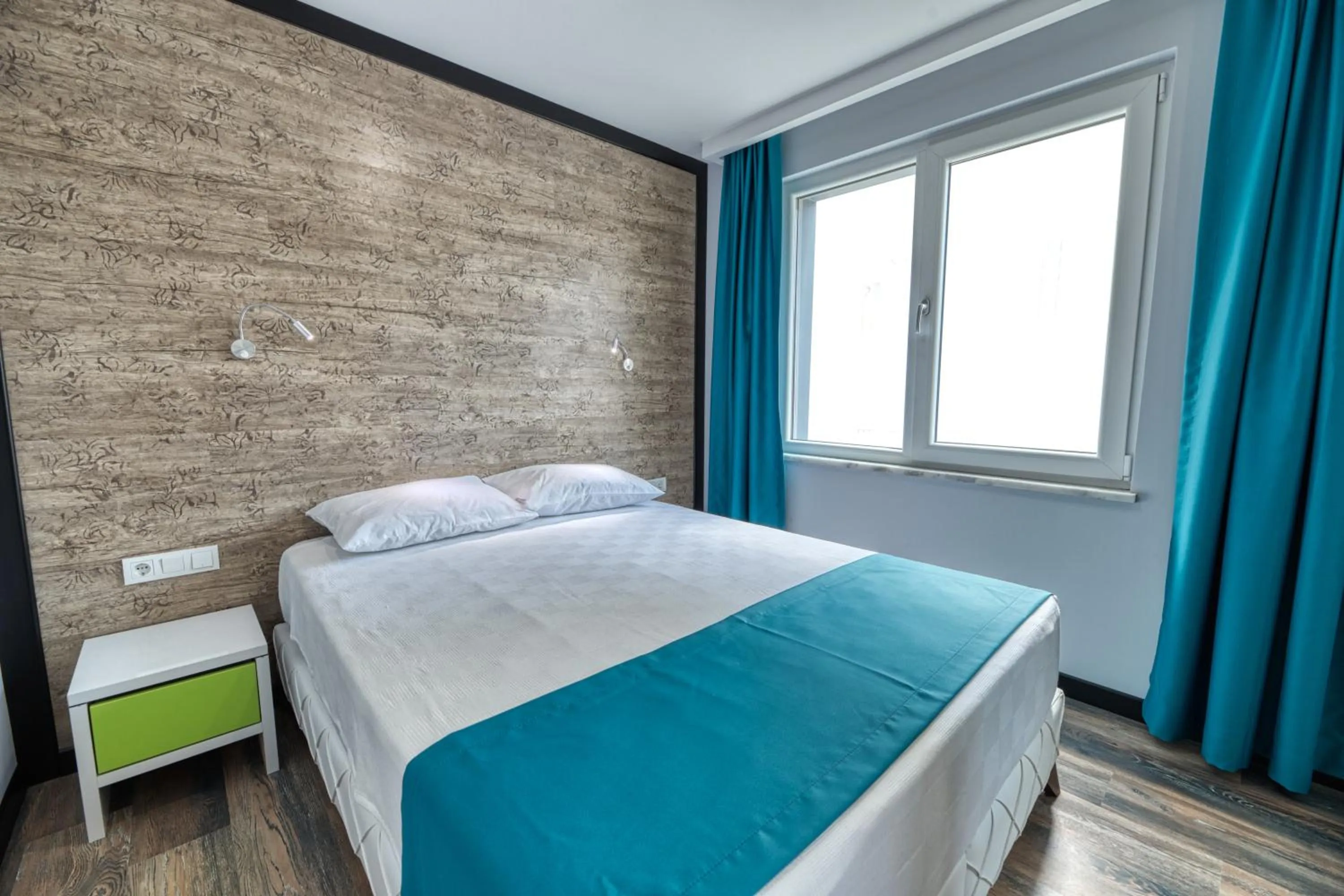 Bed in Grisverde Suites