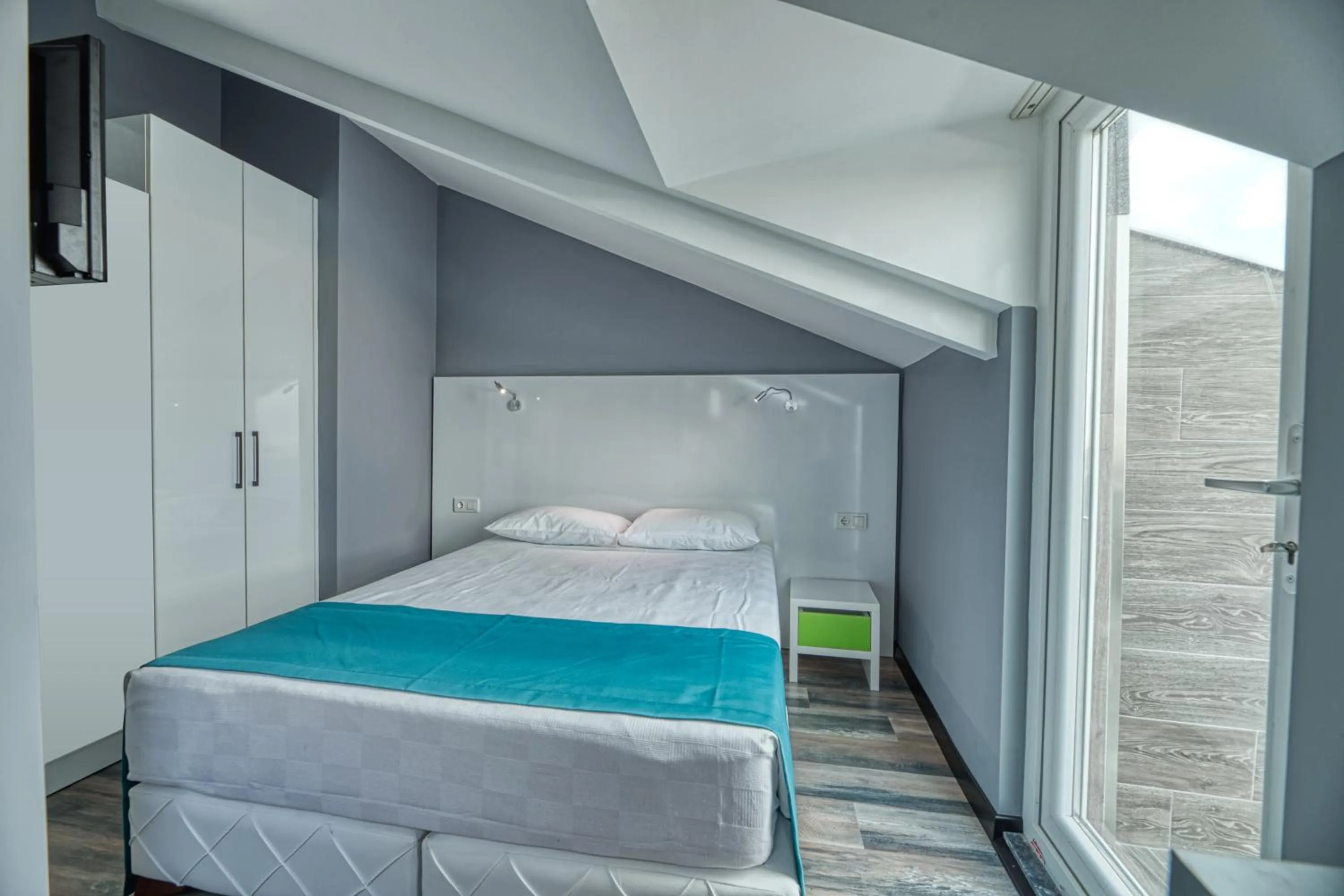 Bed in Grisverde Suites