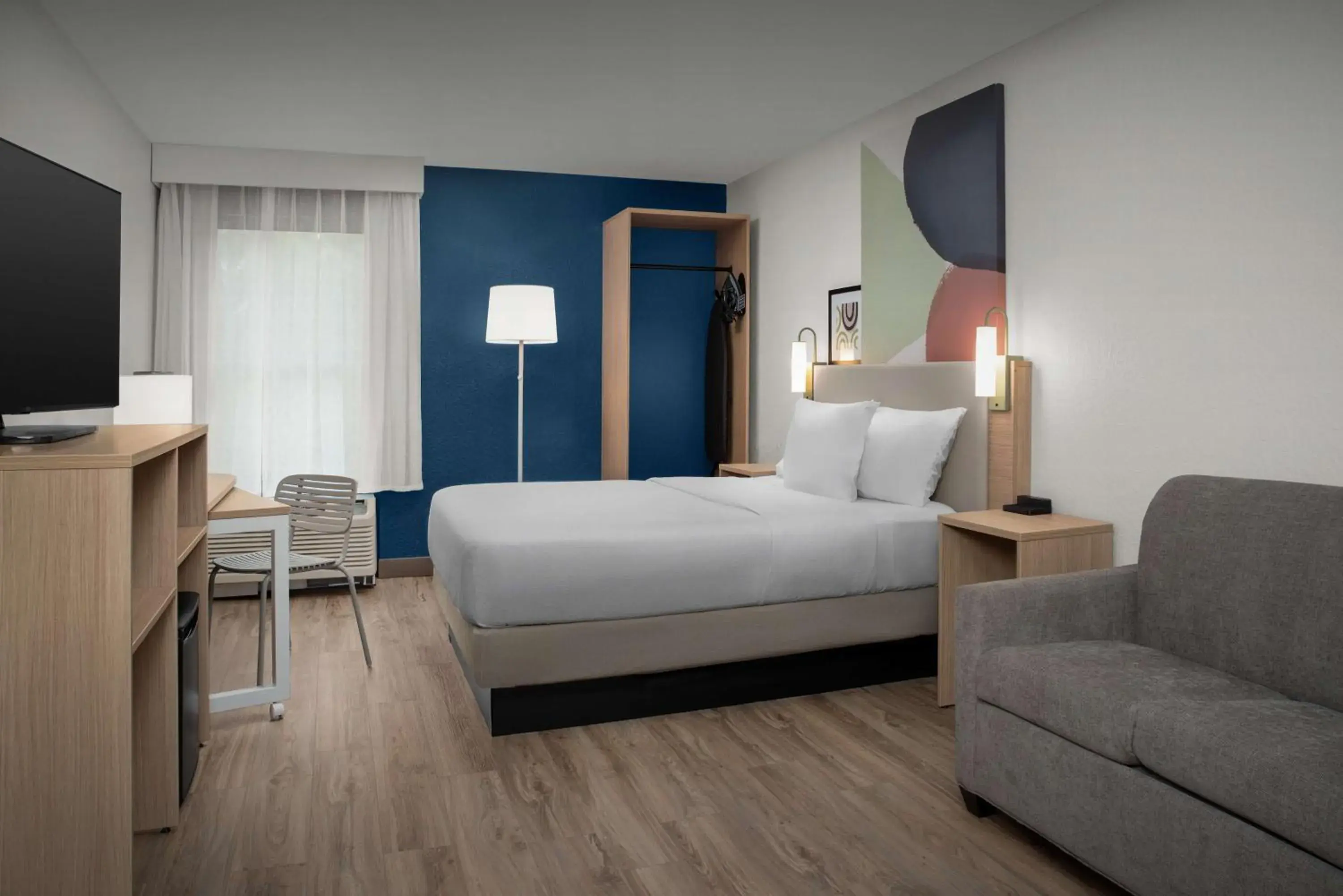 Living room, Bed in Spark by Hilton Tampa Brandon Living room, Bed in Spark by Hilton Tampa Brandon