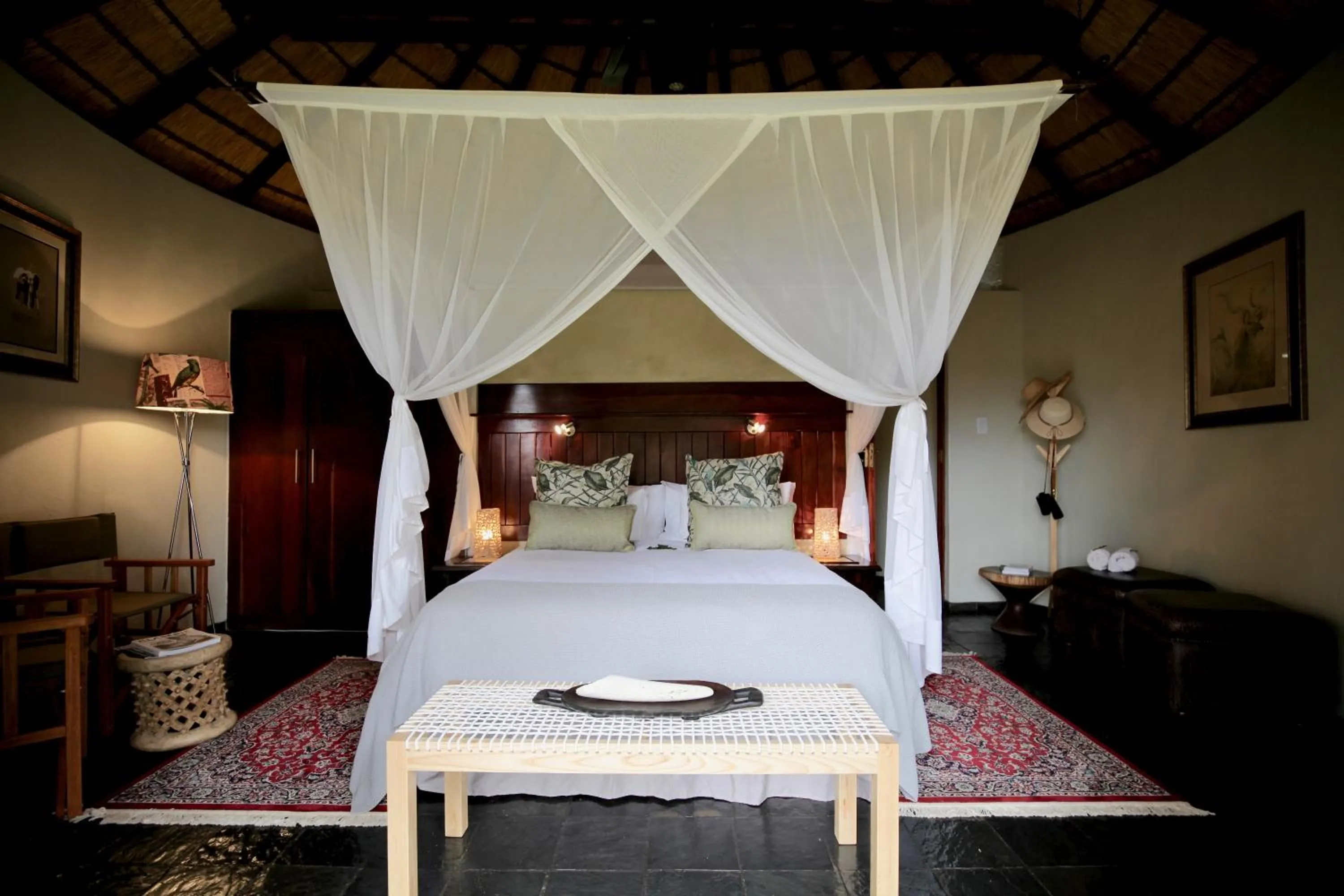 Bed in Ivory Wilderness River Rock Lodge