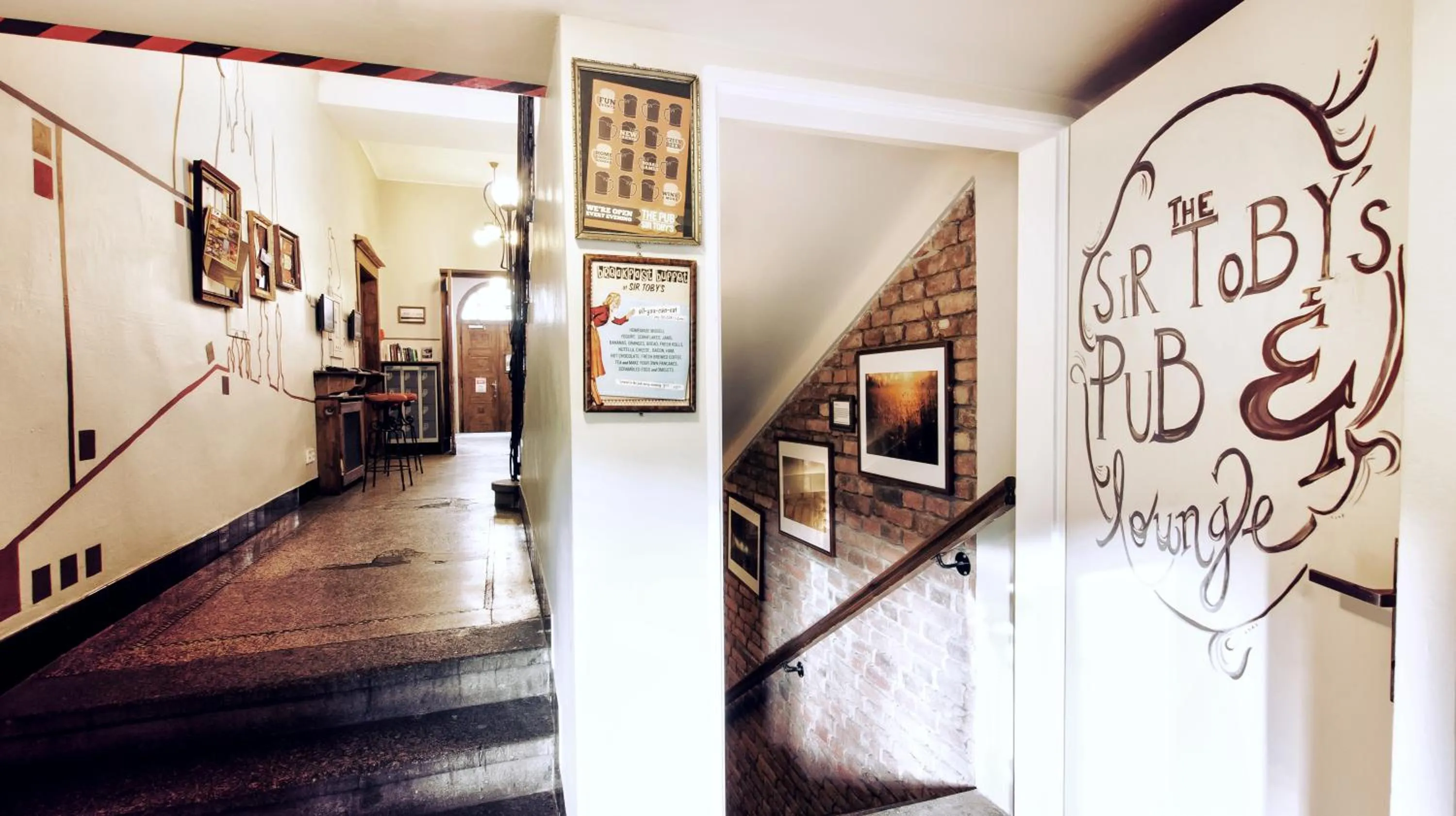 Communal lounge/ TV room in Sir Toby's Hostel