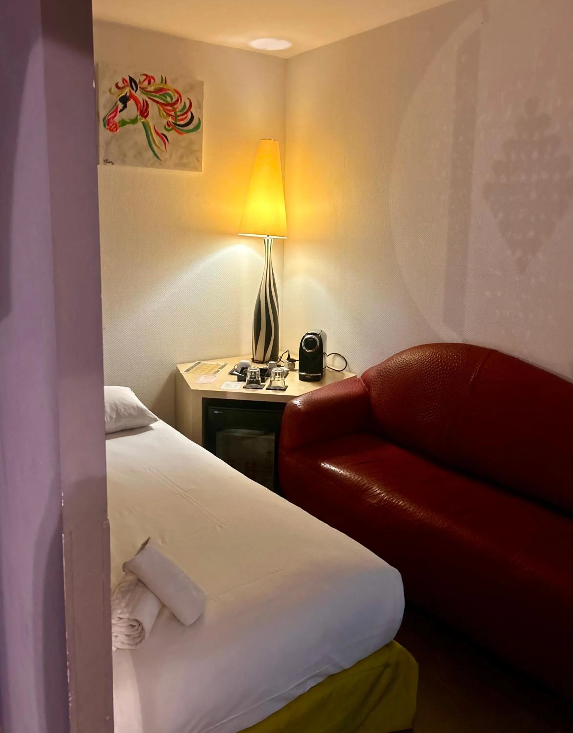 Bed in Logis Hôtel La Fauceille