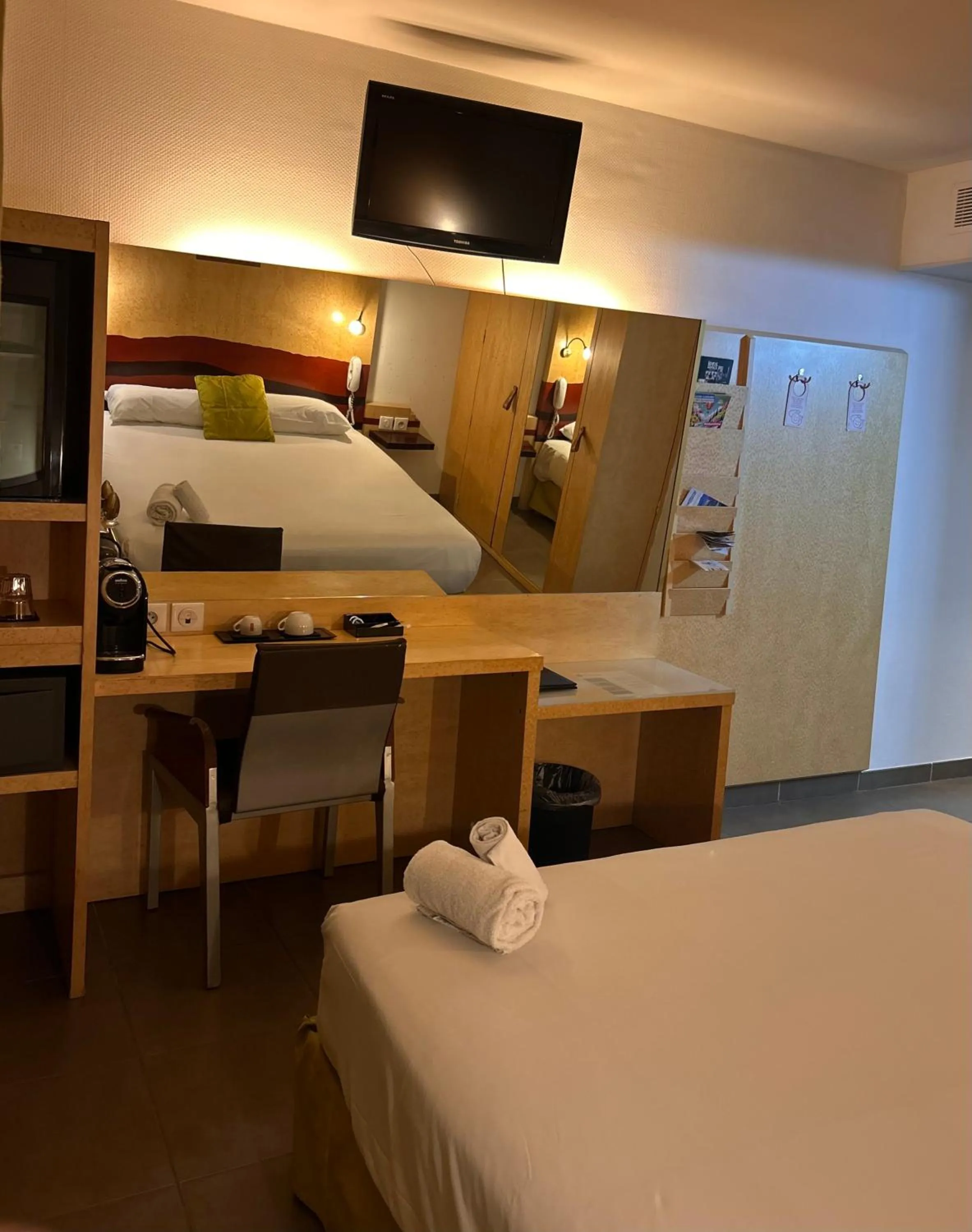 Bed in Logis Hôtel La Fauceille