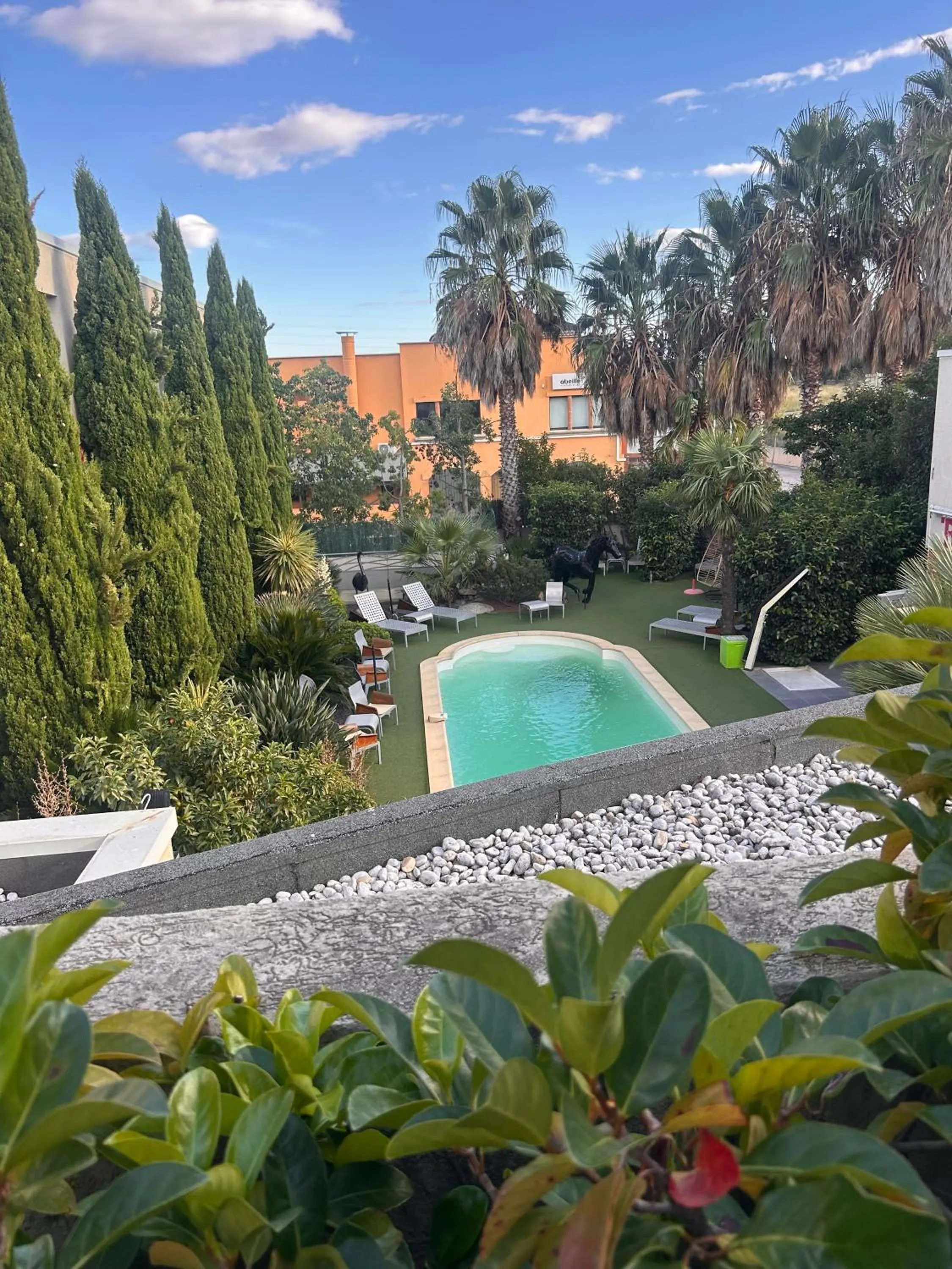 Garden view in Logis Hôtel La Fauceille