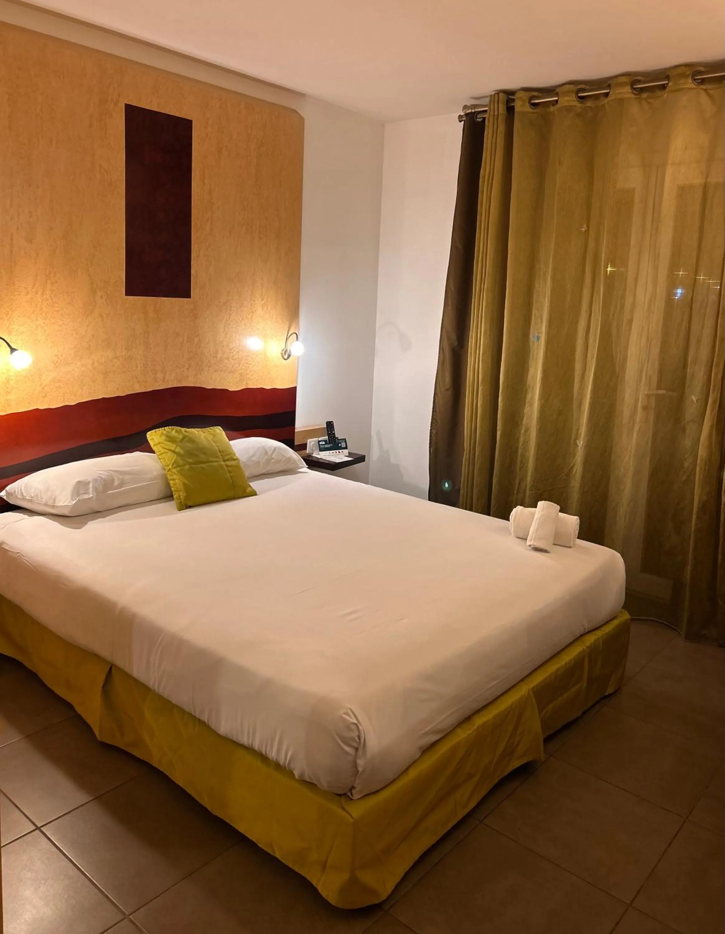 Bed in Logis Hôtel La Fauceille