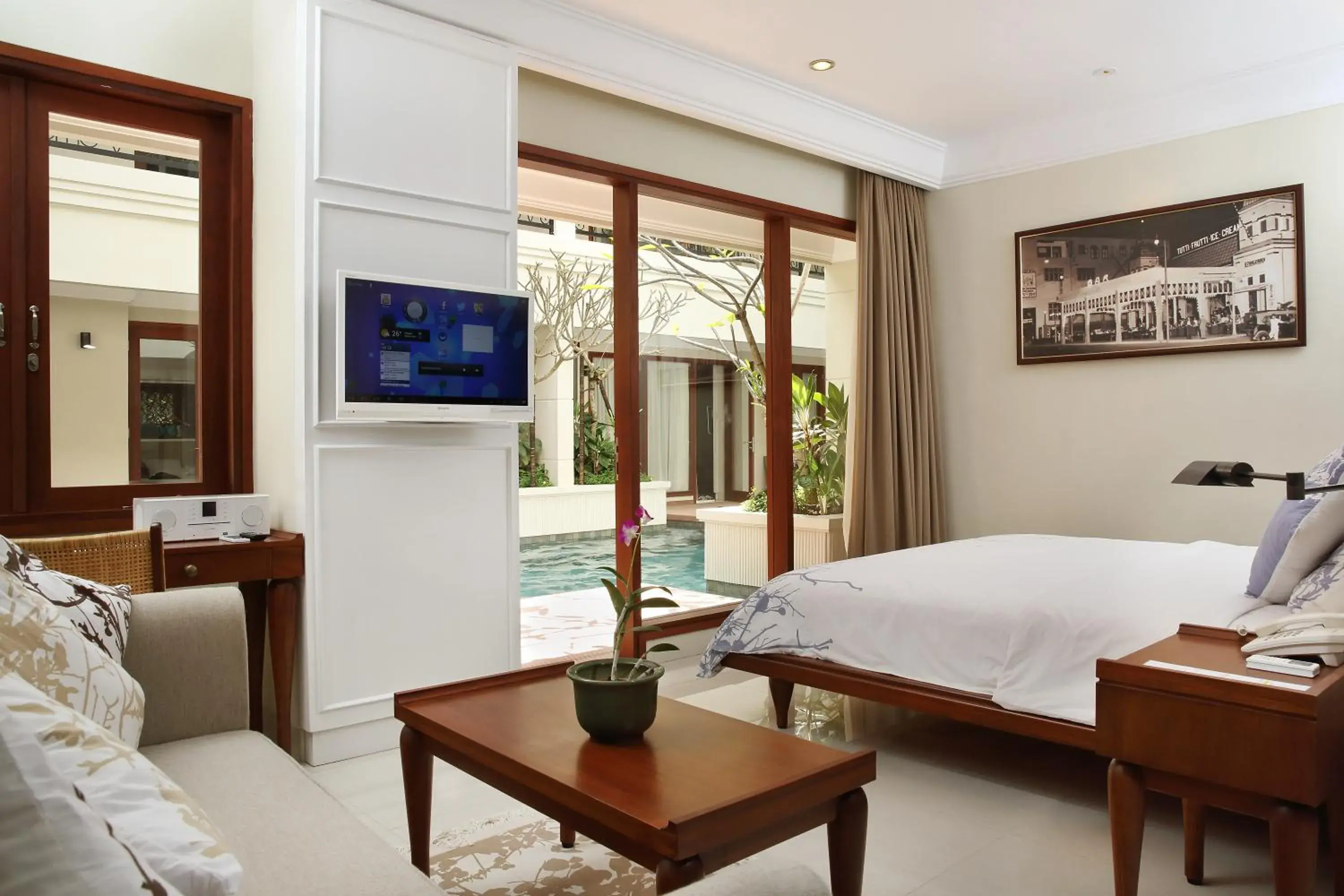 TV and multimedia, Bed in Seminyak Lagoon All Suites Hotel TV and multimedia, Bed in Seminyak Lagoon All Suites Hotel