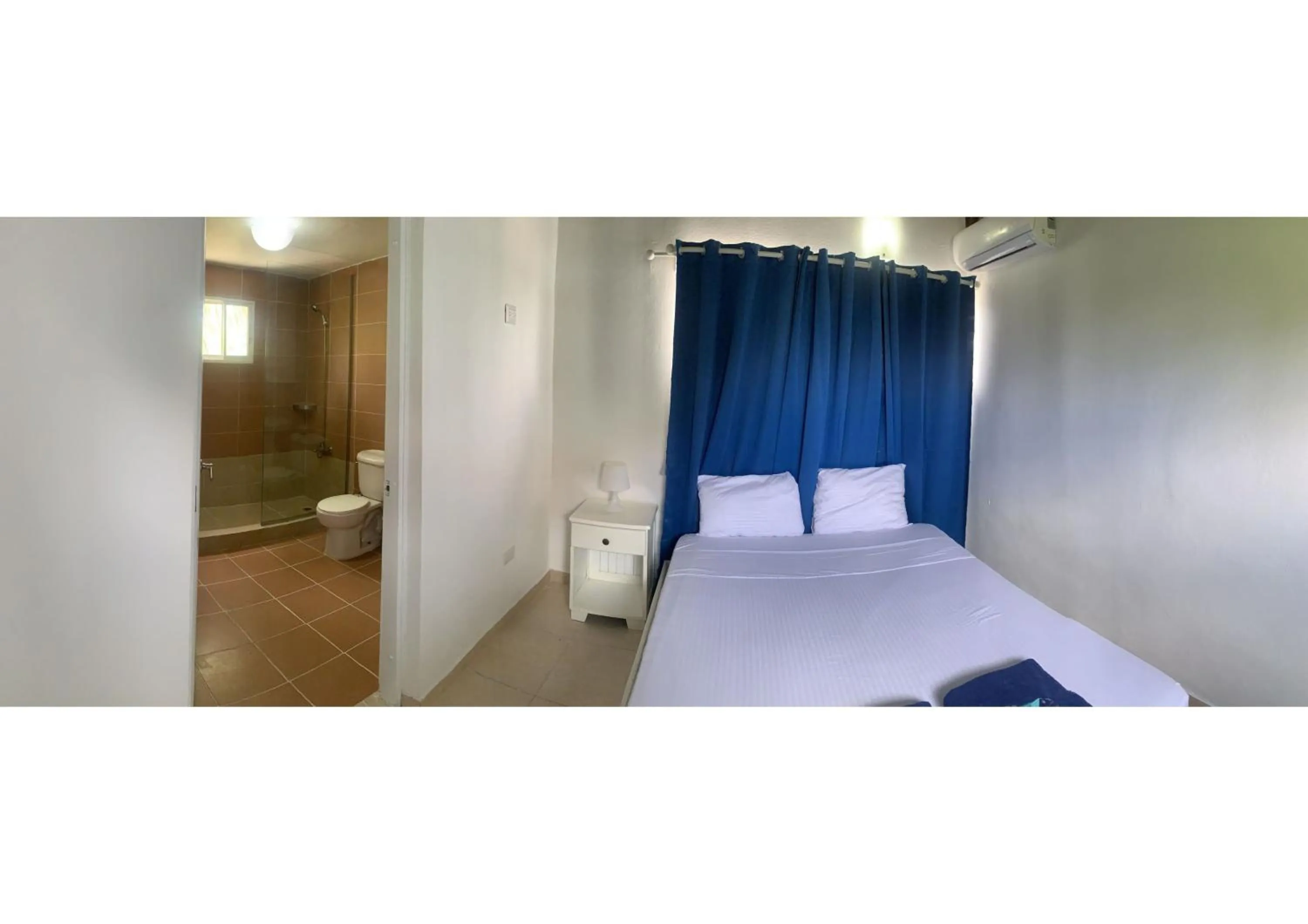 Bed in Karimar Beach Condo Hotel