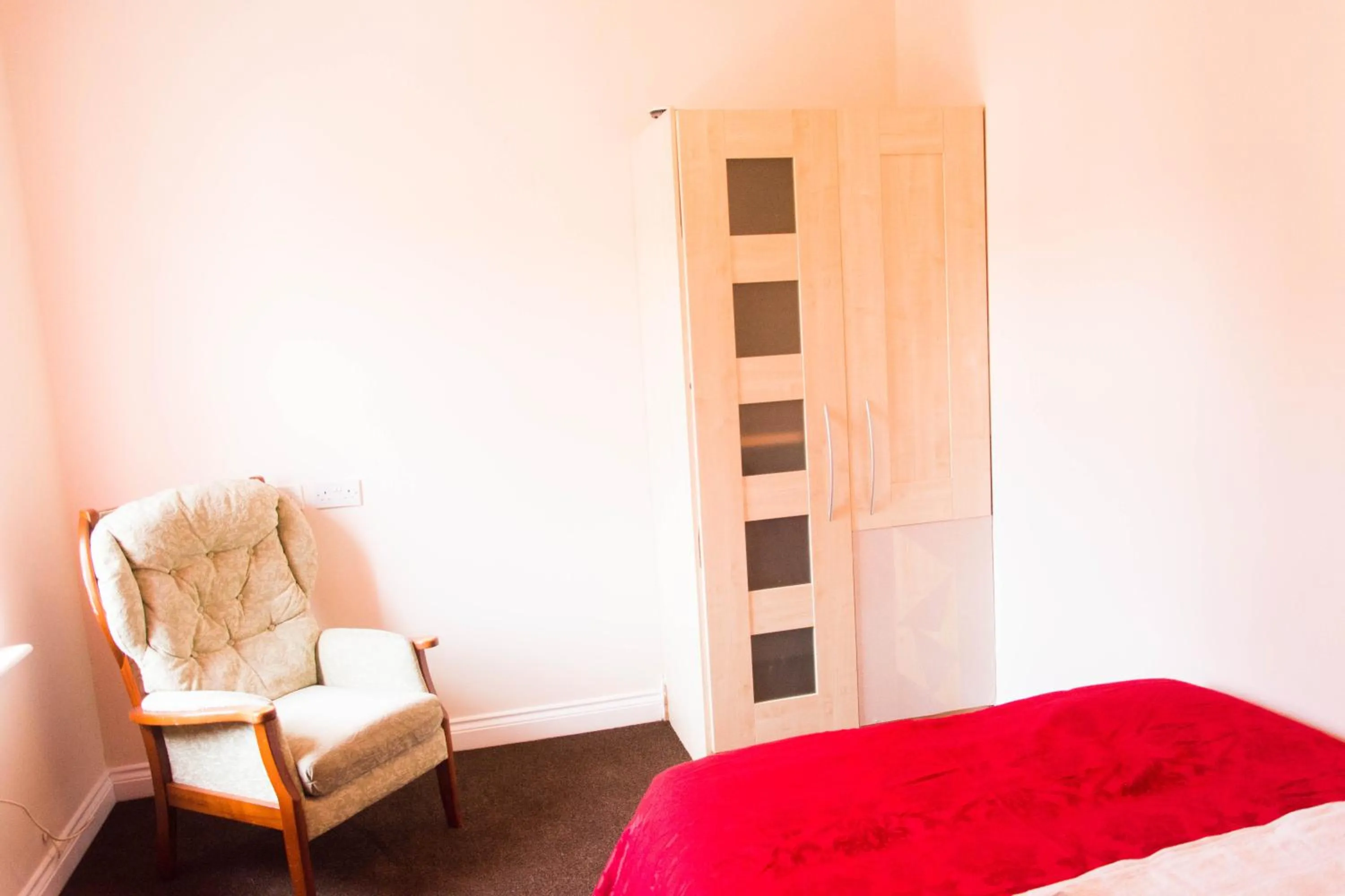 Bed in QUEEN GUEST HOUSE