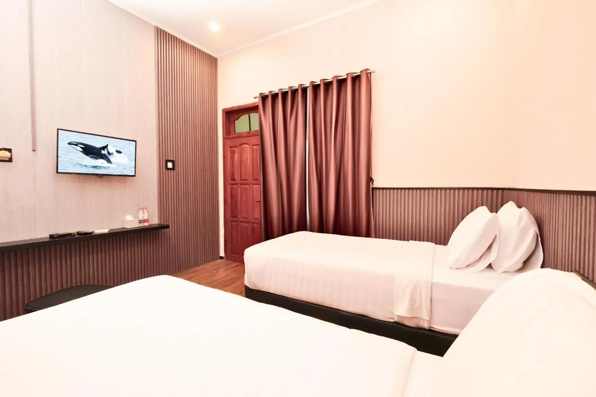 Deluxe Twin Room in Berlian Abadi Hotel by Sinergi Deluxe Twin Room in Berlian Abadi Hotel by Sinergi