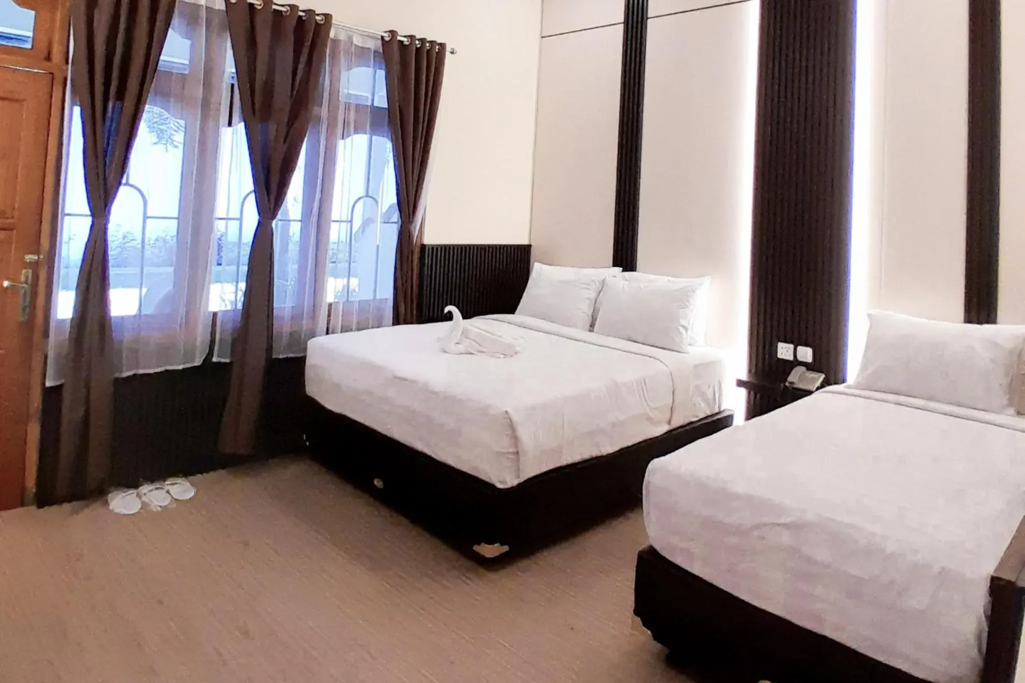 Executive Triple Room in Berlian Abadi Hotel by Sinergi Executive Triple Room in Berlian Abadi Hotel by Sinergi