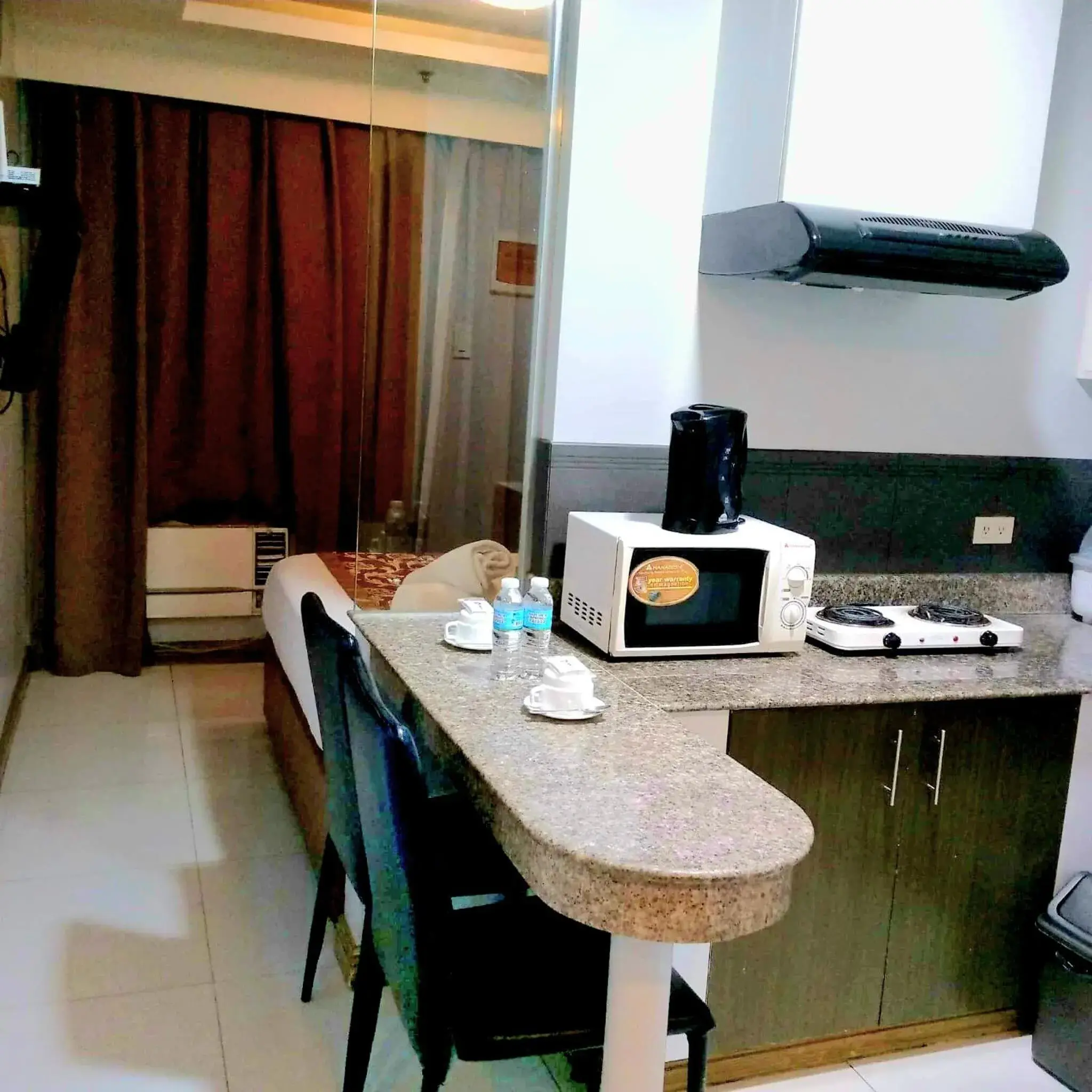 Kitchen or kitchenette in JMM Grand Suites Kitchen or kitchenette in JMM Grand Suites