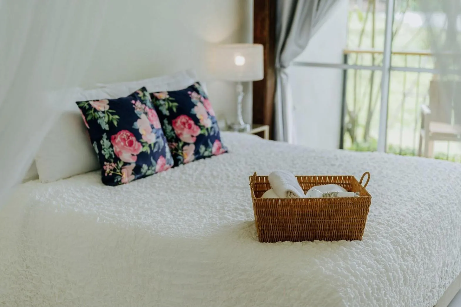 Bed in White Wall Riverfront Hotel