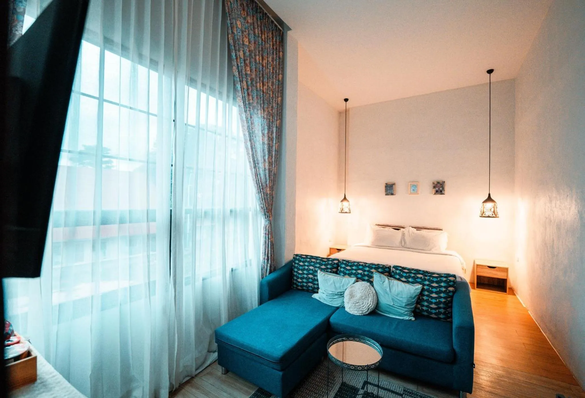 Bed in White Wall Riverfront Hotel