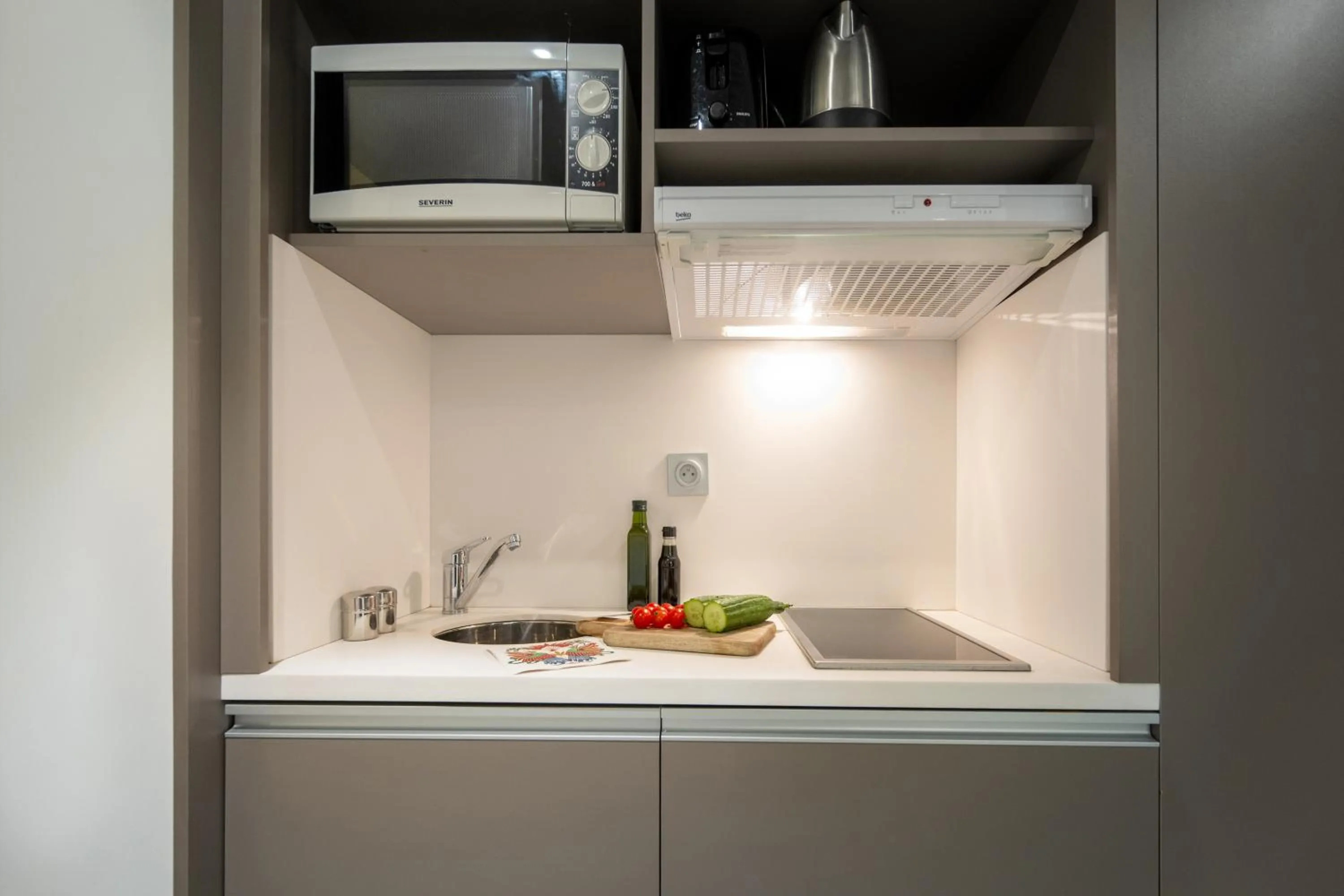 Kitchen or kitchenette in Nemea Appart Hotel Concorde Toulouse Gare Matabiau